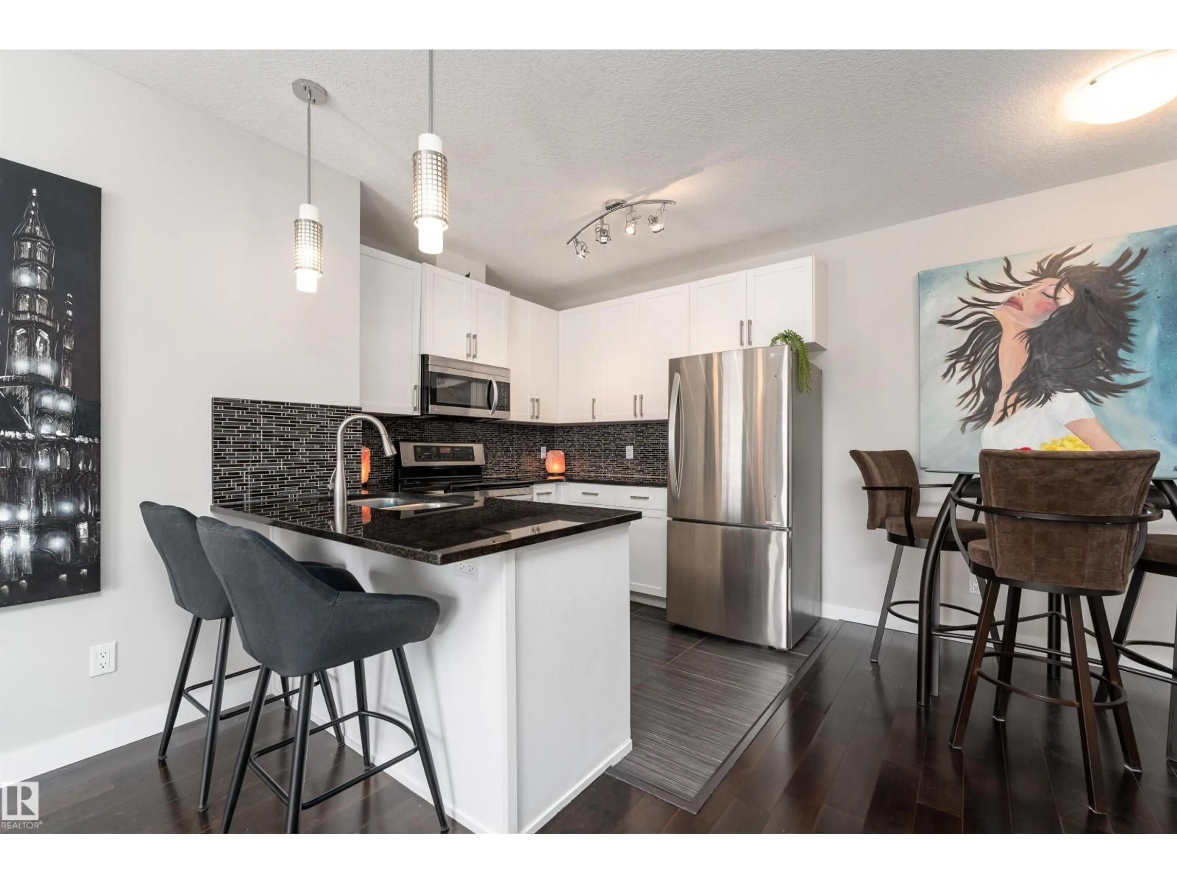Open concept kitchen, wood/laminate floor for 5151 - 224 WINDERMERE BV, Edmonton Alberta T6W2K4