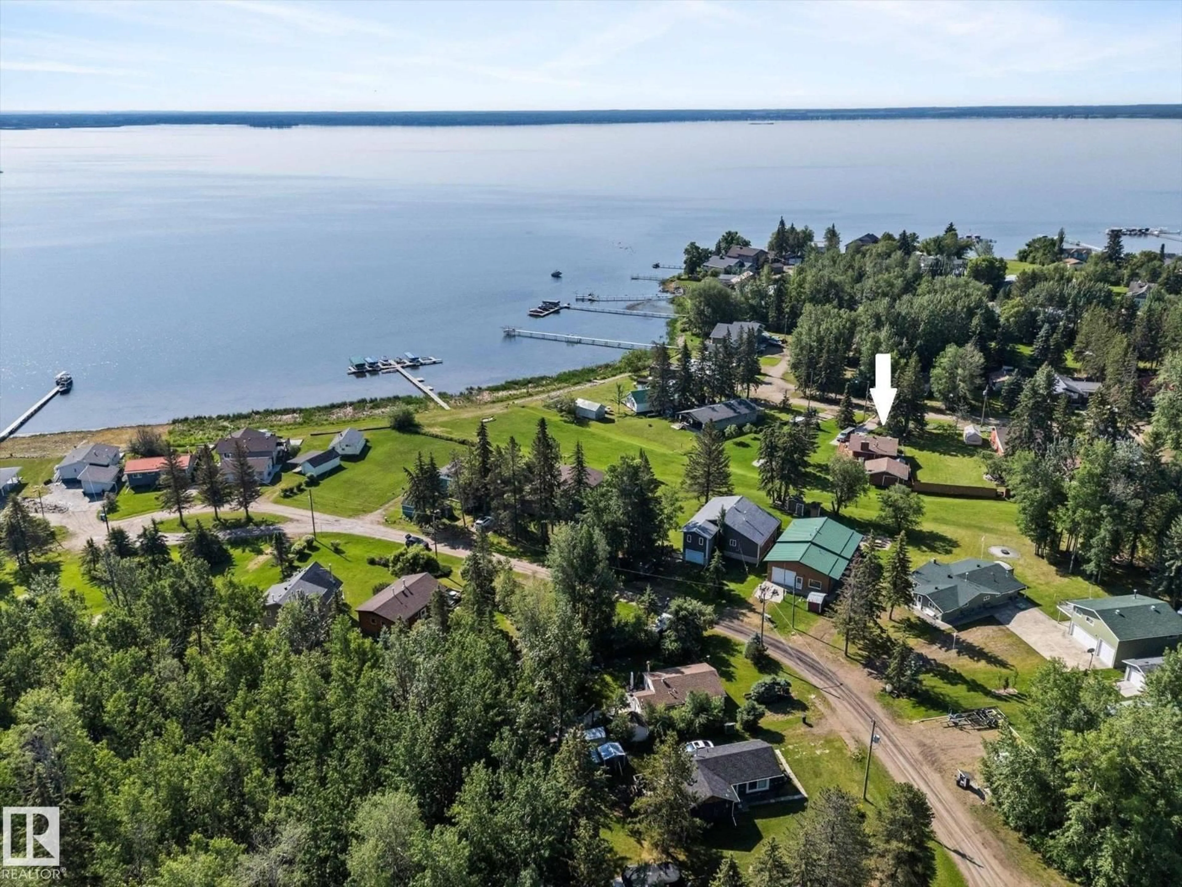 A pic from outside/outdoor area/front of a property/back of a property/a pic from drone, water/lake/river/ocean view for 309 - 308 3 ST, Rural Lac Ste. Anne County Alberta T0E1A0