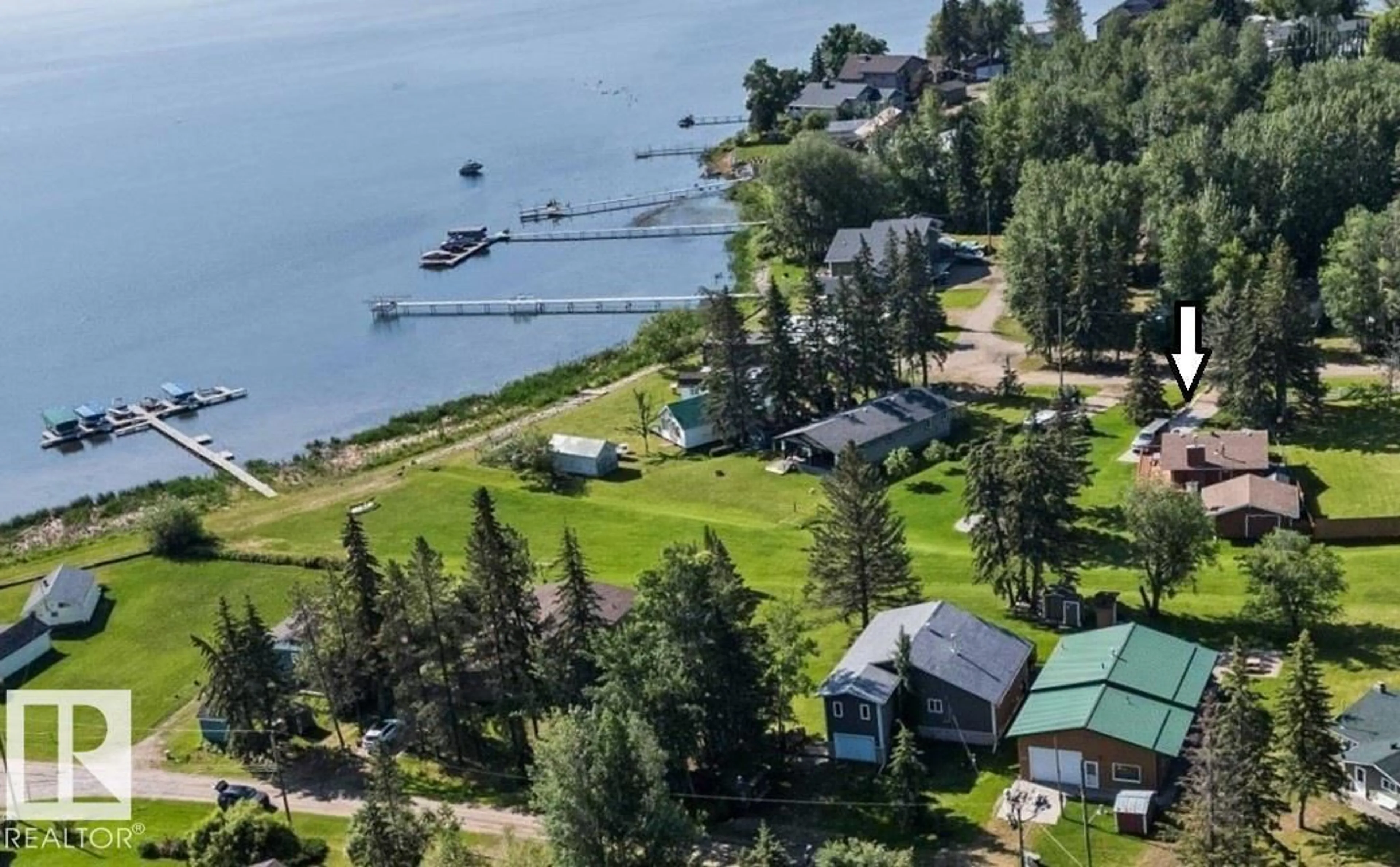 A pic from outside/outdoor area/front of a property/back of a property/a pic from drone, water/lake/river/ocean view for 309 - 308 3 ST, Rural Lac Ste. Anne County Alberta T0E1A0