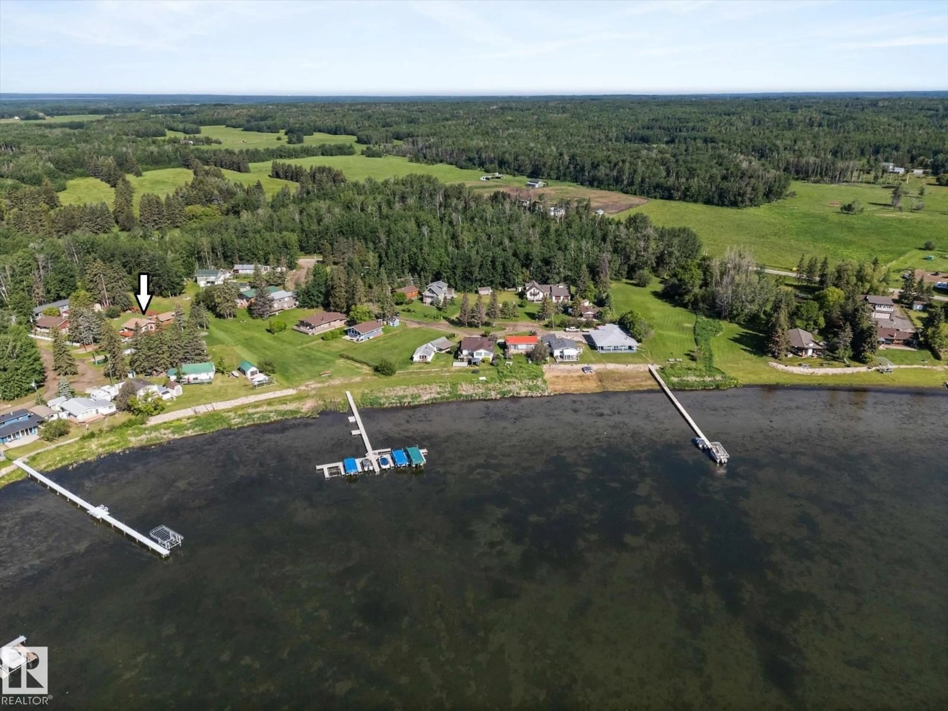 A pic from outside/outdoor area/front of a property/back of a property/a pic from drone, water/lake/river/ocean view for 309 - 308 3 ST, Rural Lac Ste. Anne County Alberta T0E1A0