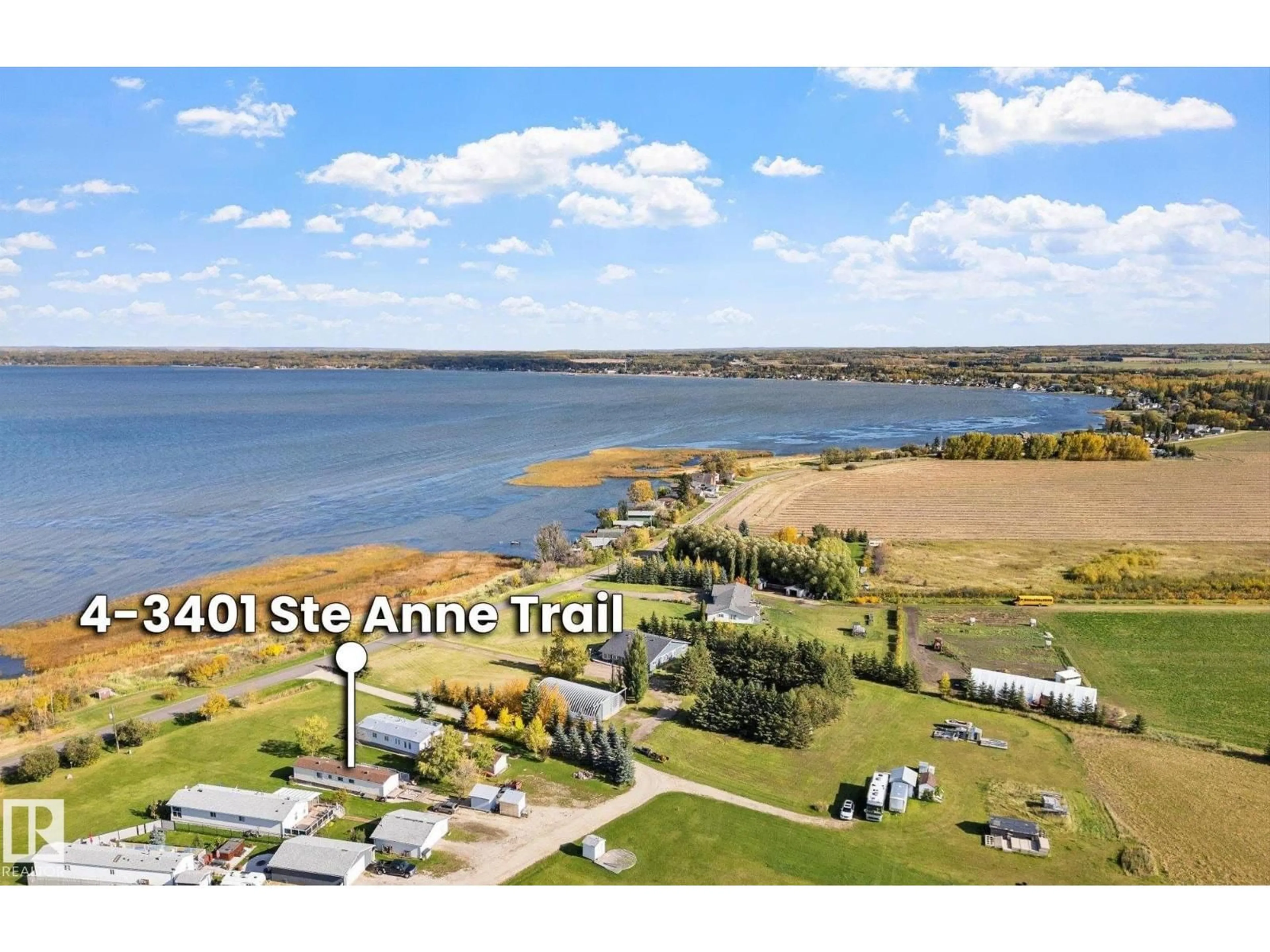 A pic from outside/outdoor area/front of a property/back of a property/a pic from drone, water/lake/river/ocean view for #4 - 3401 STE. ANNE TRAIL, Rural Lac Ste. Anne County Alberta T0E0A1