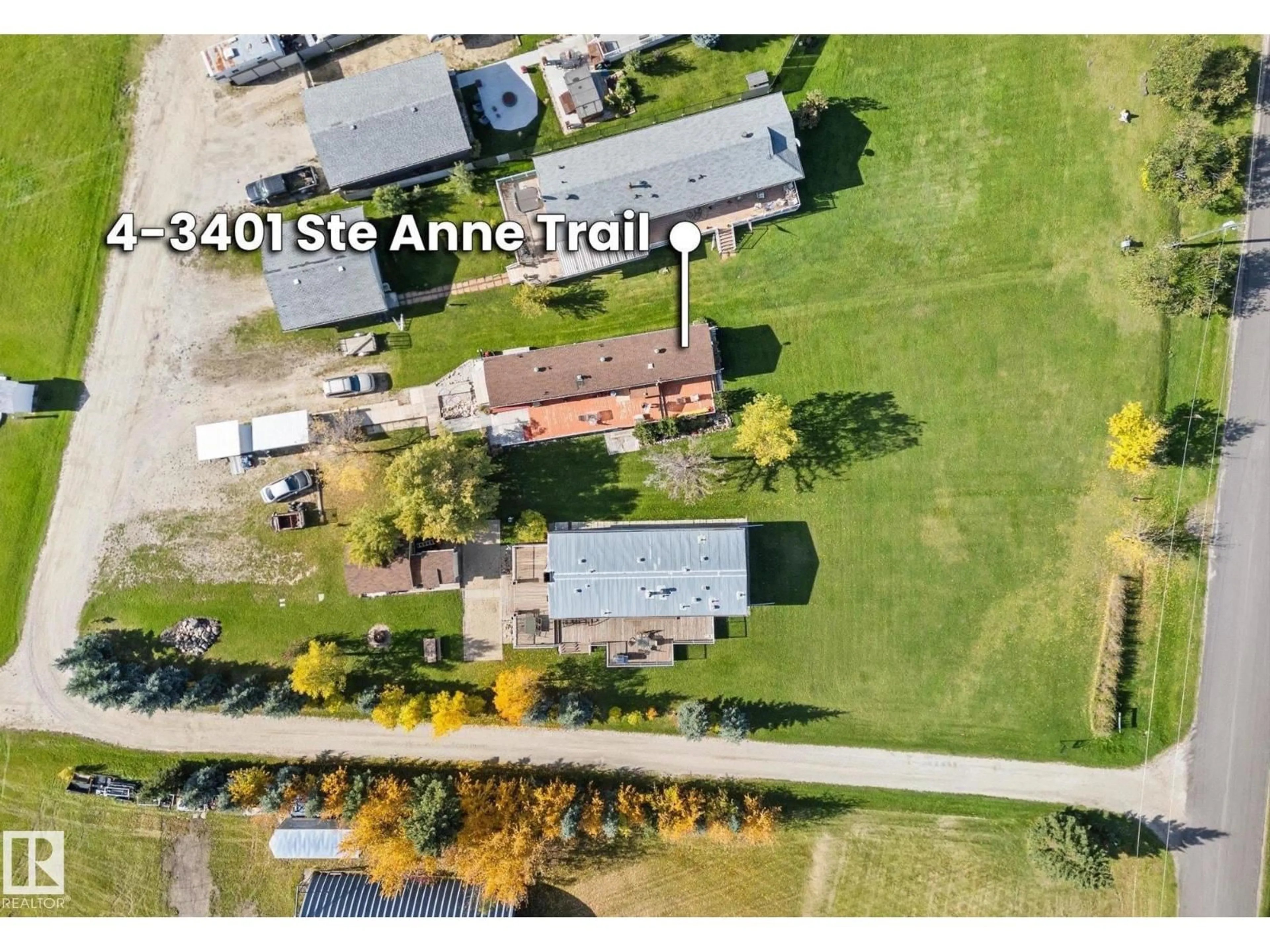A pic from outside/outdoor area/front of a property/back of a property/a pic from drone, street for #4 - 3401 STE. ANNE TRAIL, Rural Lac Ste. Anne County Alberta T0E0A1