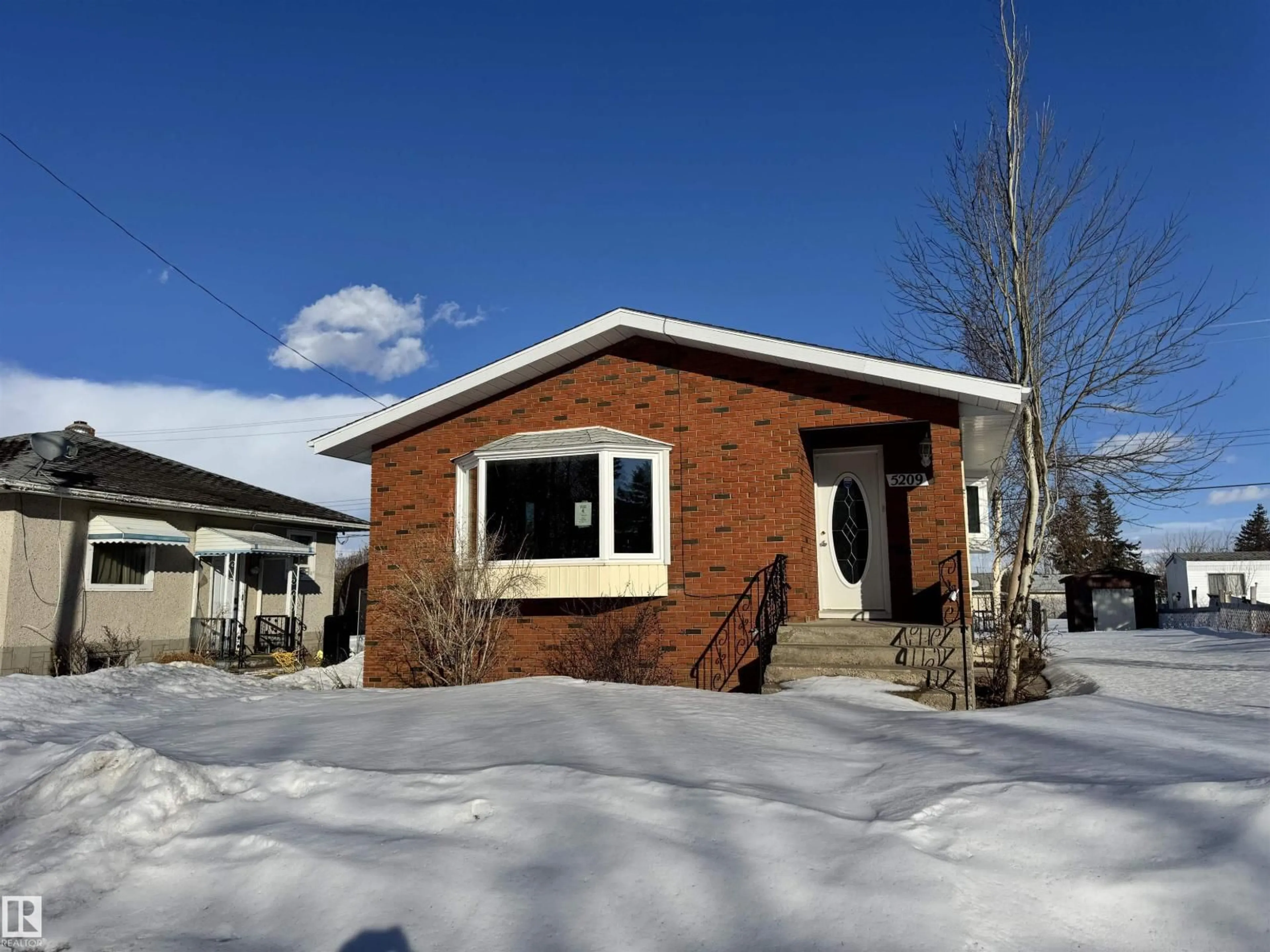 Home with brick exterior material, street for 5209 51 ST, Andrew Alberta T0B0C0
