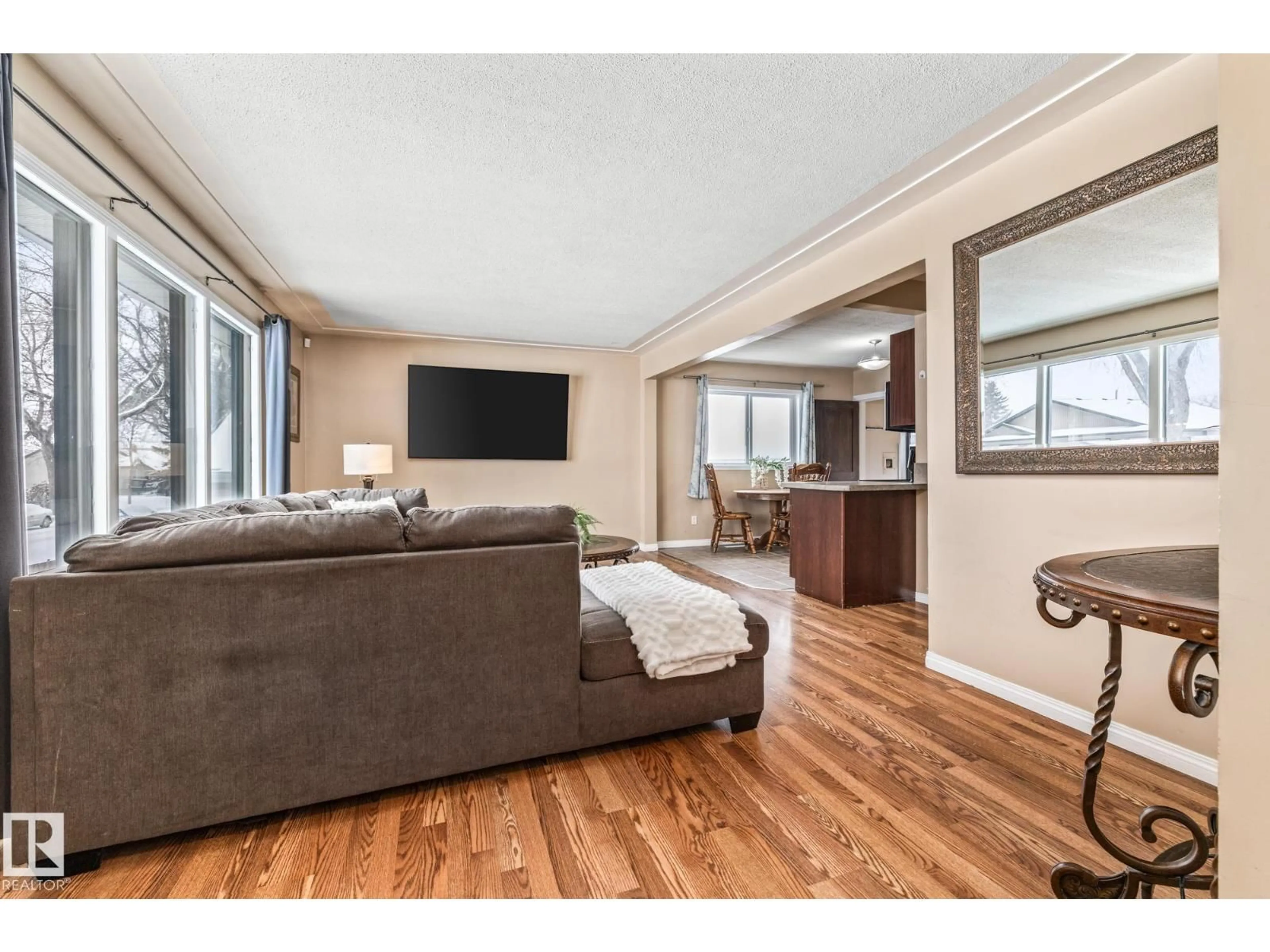 Living room with furniture, wood/laminate floor for 12752 116 ST, Edmonton Alberta T5E5H2