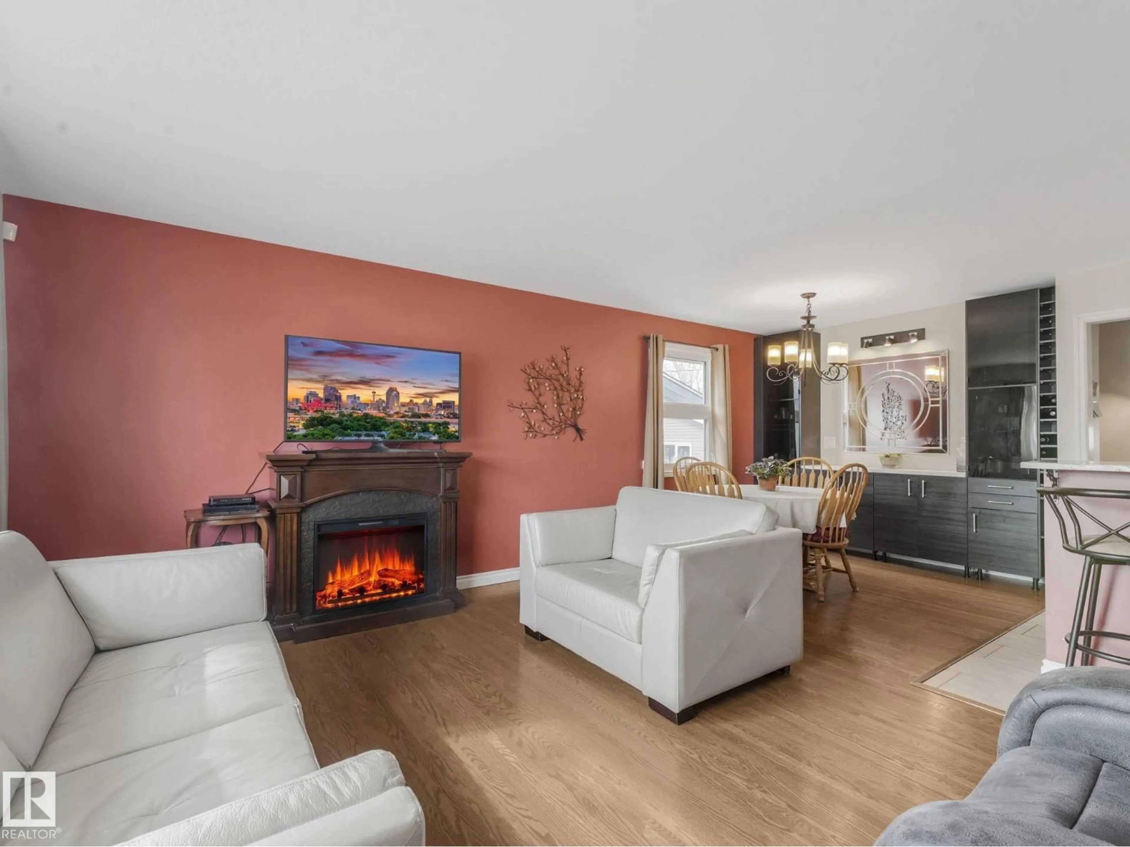 Living room with furniture, wood/laminate floor for 16106 79A AV NW, Edmonton Alberta T5R3J1