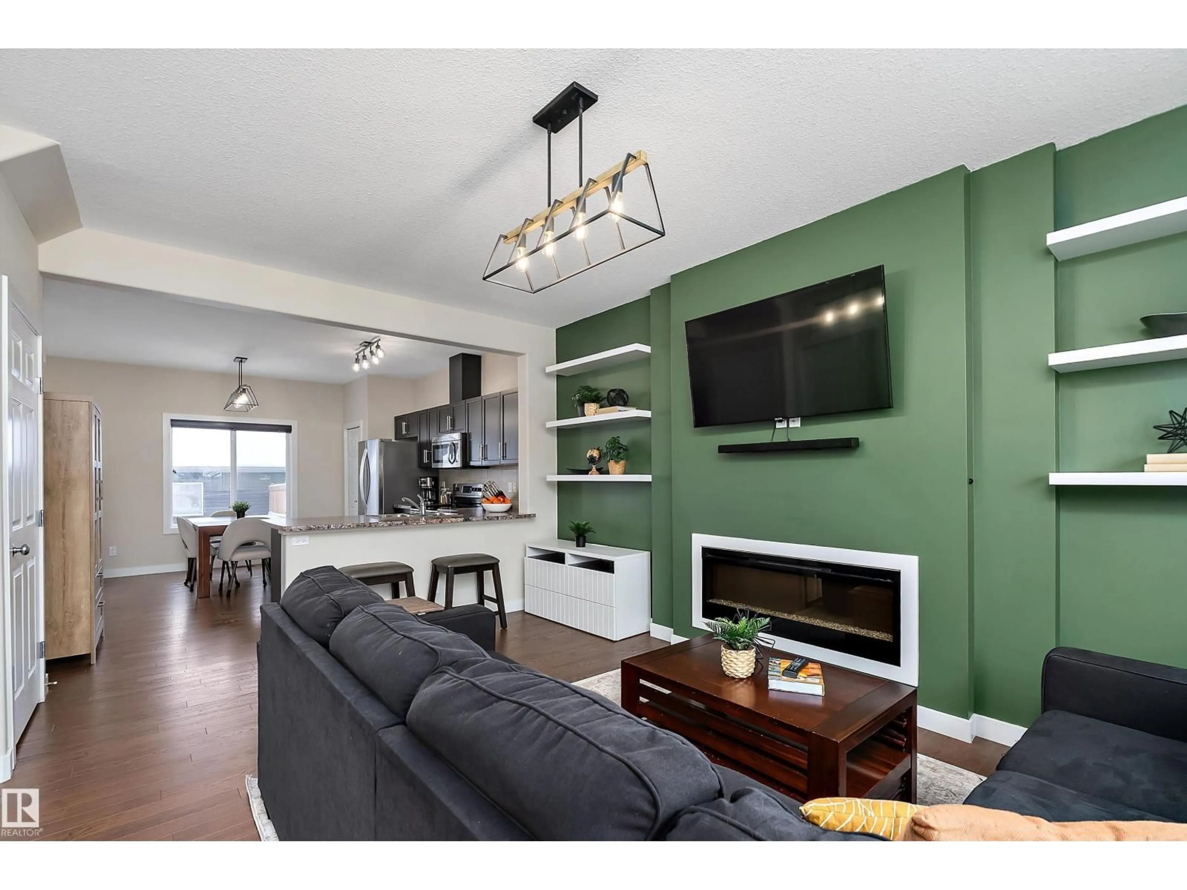 Living room with furniture, wood/laminate floor for 368 PIONEER RD, Spruce Grove Alberta T7X0T1