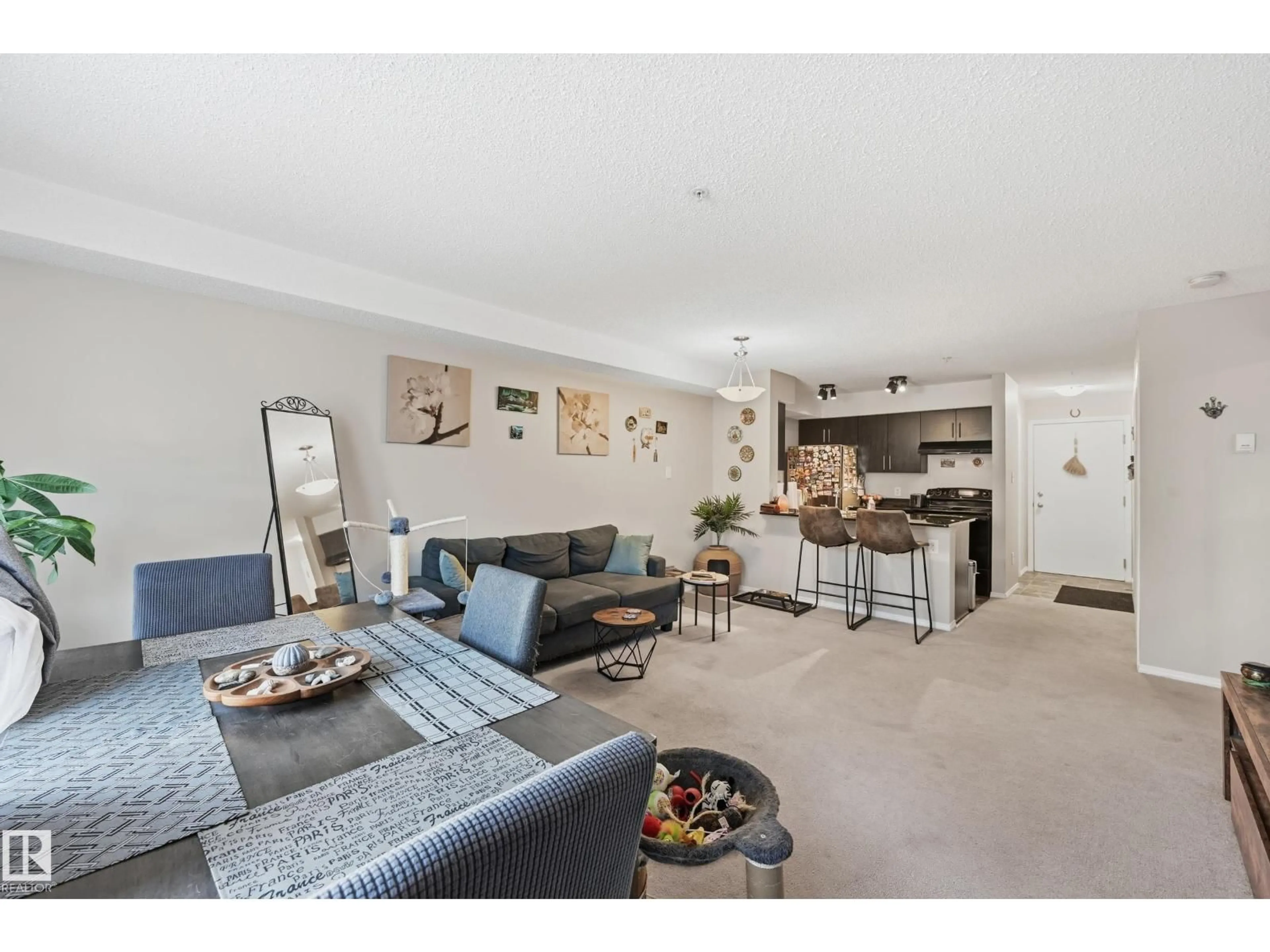 Living room with furniture, unknown for 1080 - 207 MCCONACHIE BV, Edmonton Alberta T5Y0X2