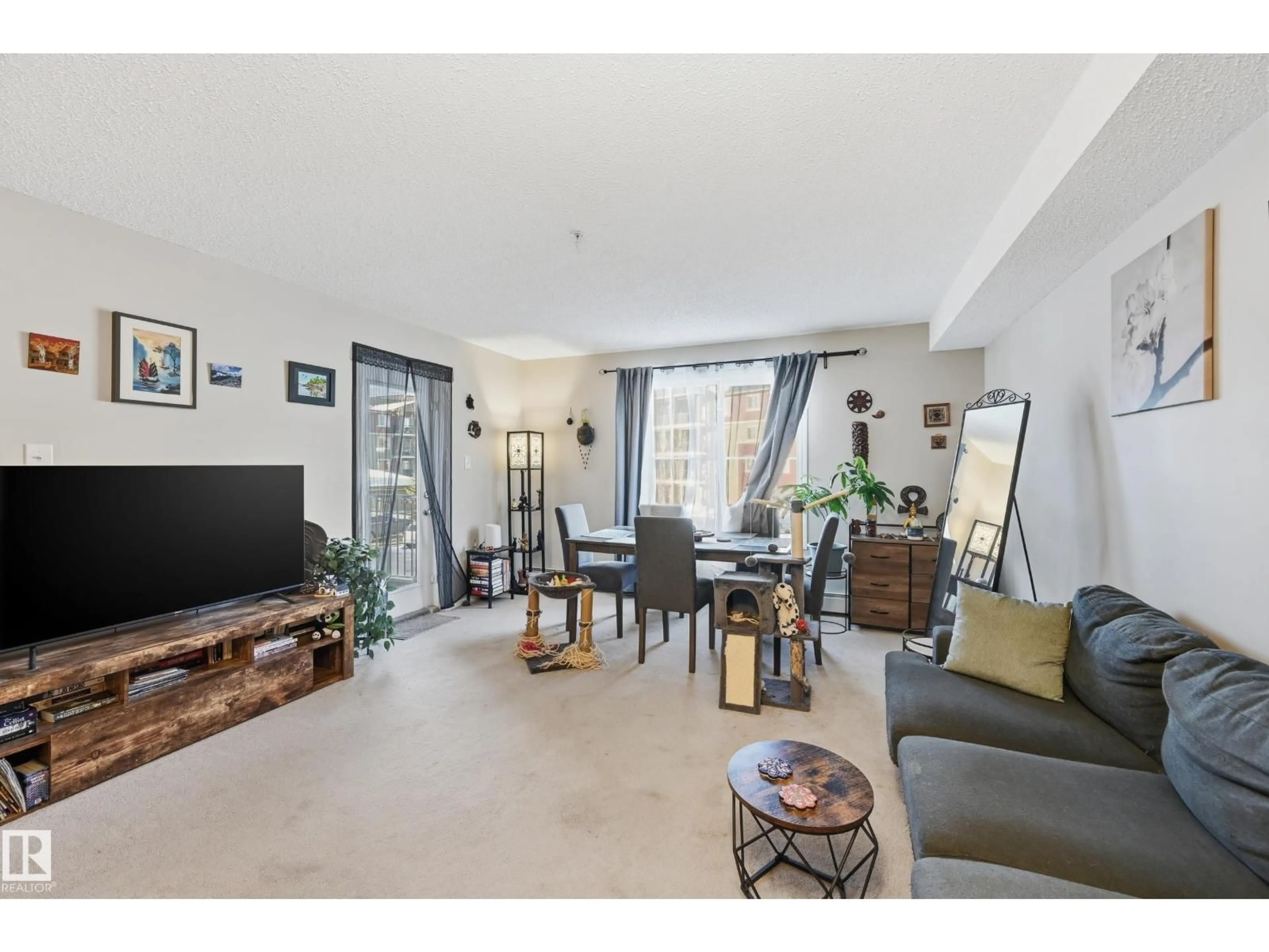 Living room with furniture, unknown for 1080 - 207 MCCONACHIE BV, Edmonton Alberta T5Y0X2