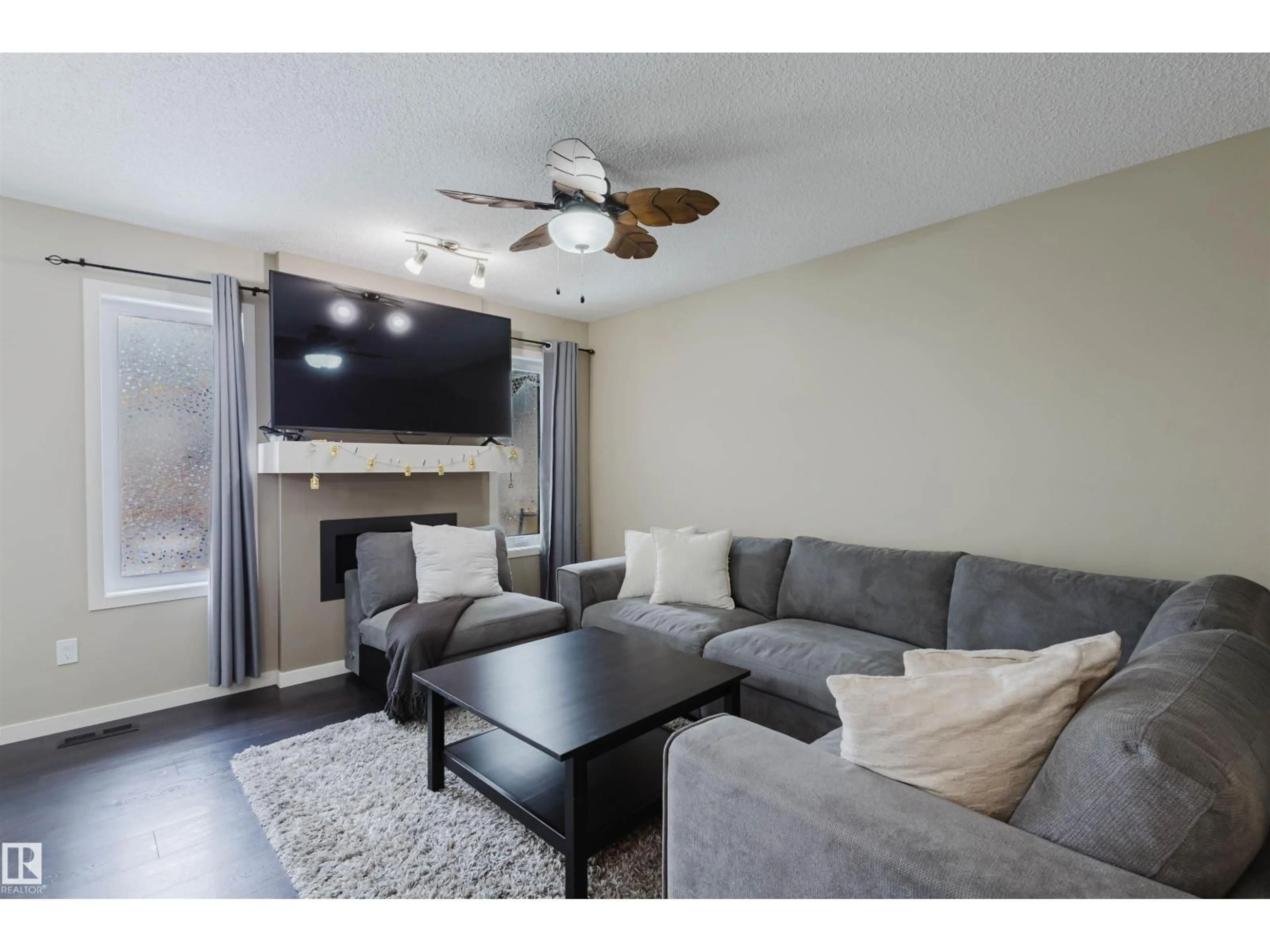 Living room with furniture, wood/laminate floor for 16811 120 ST, Edmonton Alberta T5X0H7