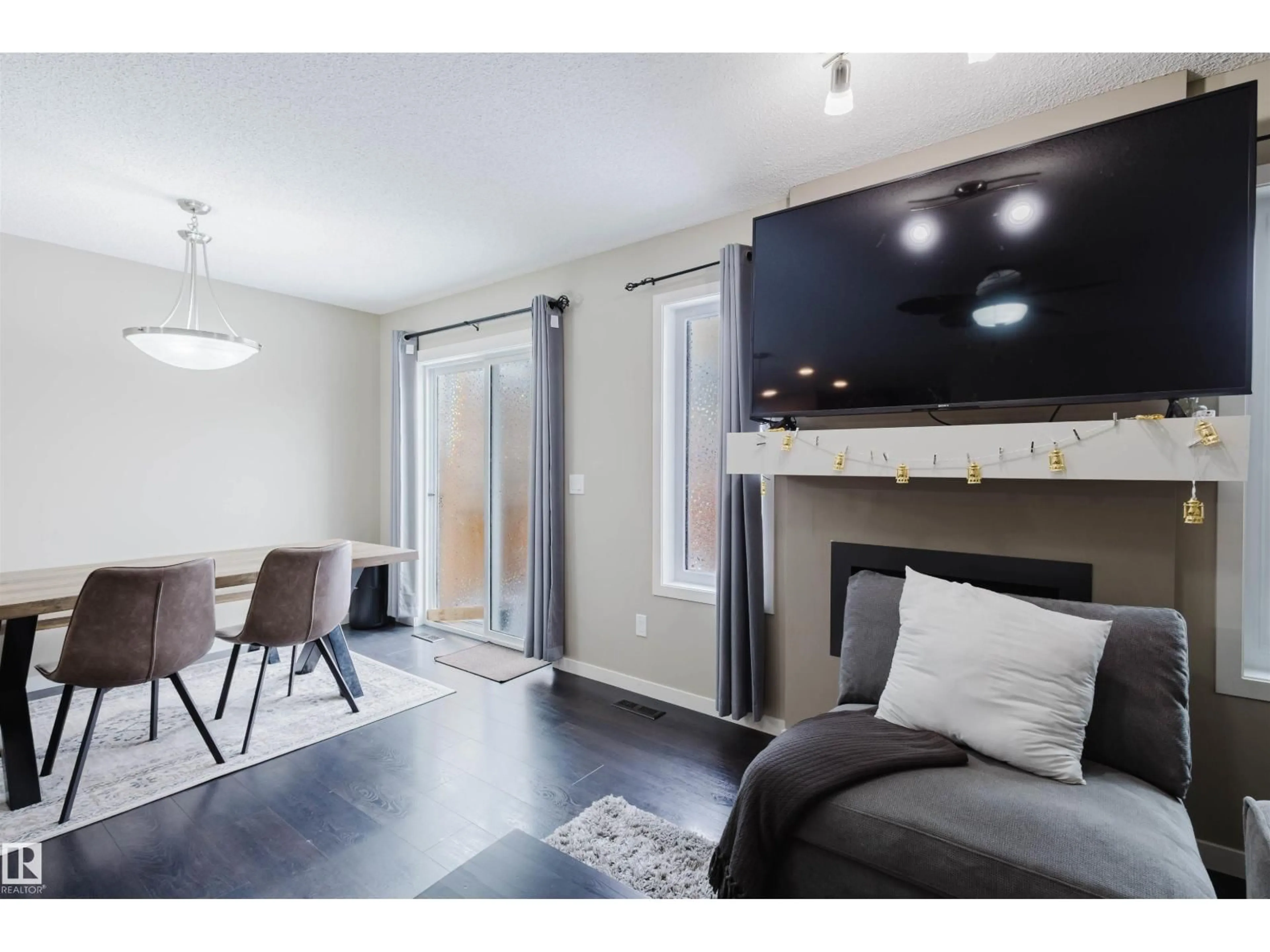 Living room with furniture, wood/laminate floor for 16811 120 ST, Edmonton Alberta T5X0H7