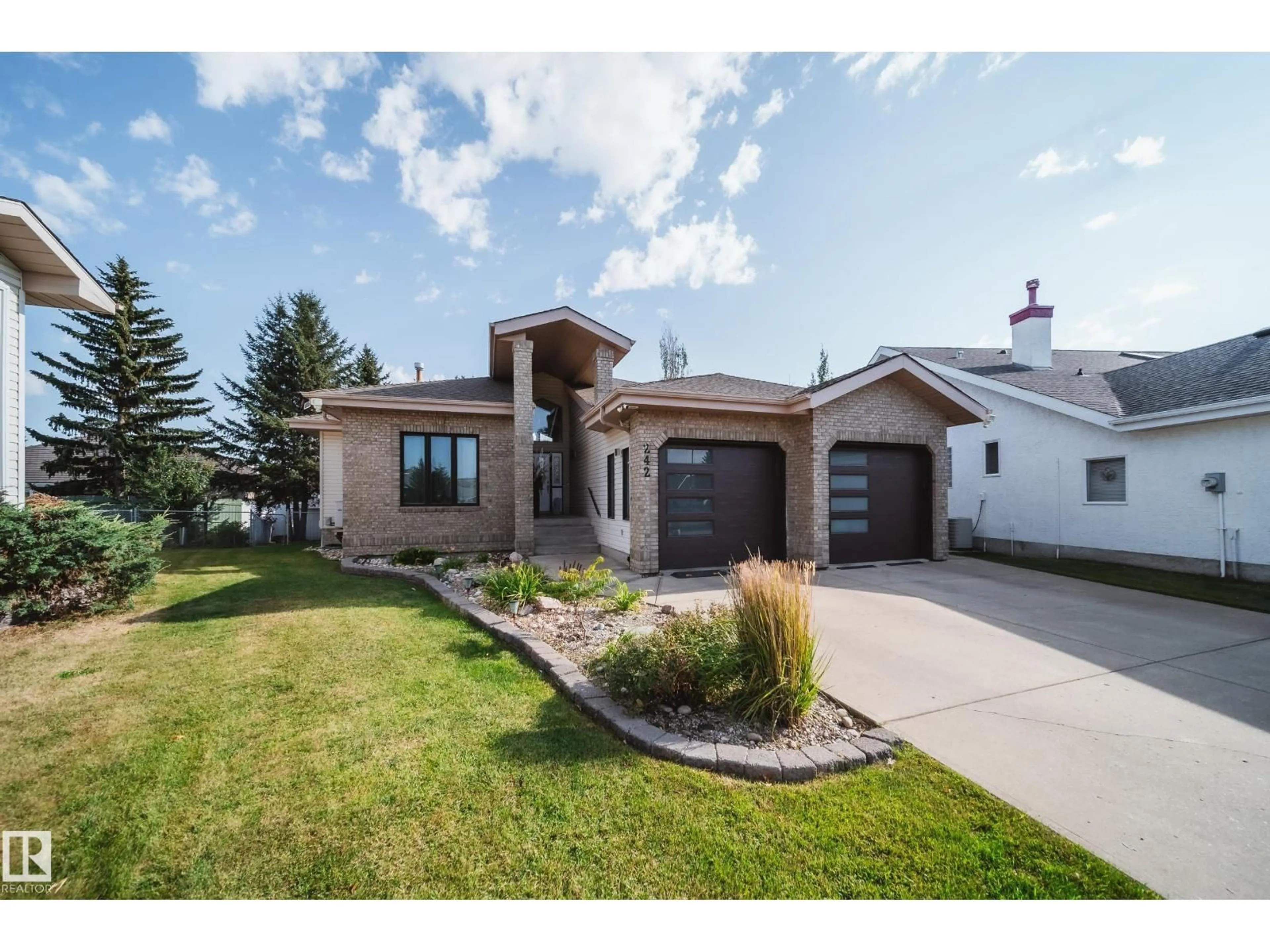 Home with brick exterior material, street for 242 RUNNING CREEK LN, Edmonton Alberta T6J6V9