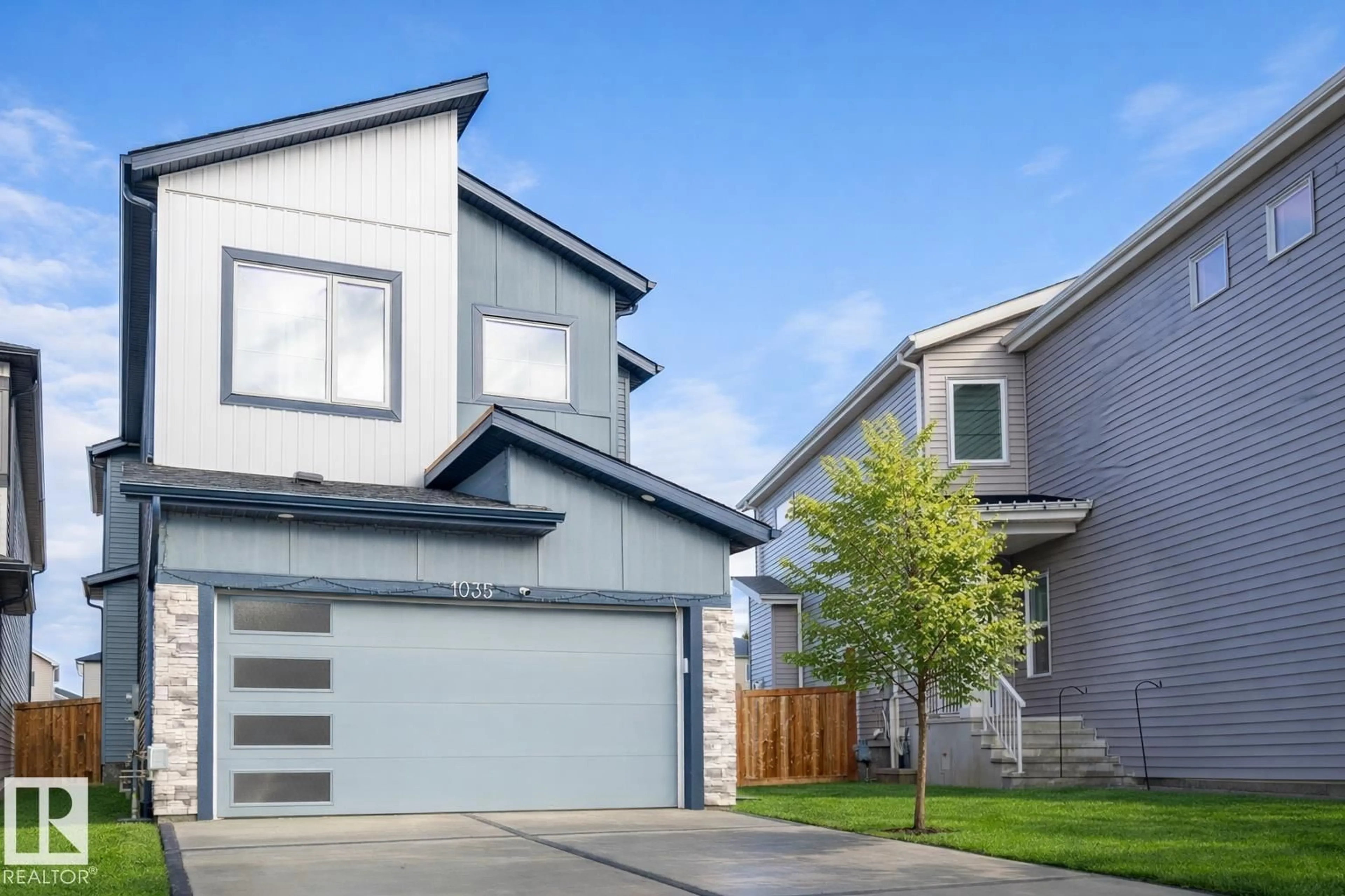 Home with vinyl exterior material, street for 1035 BERG PL, Leduc Alberta T9E1M4