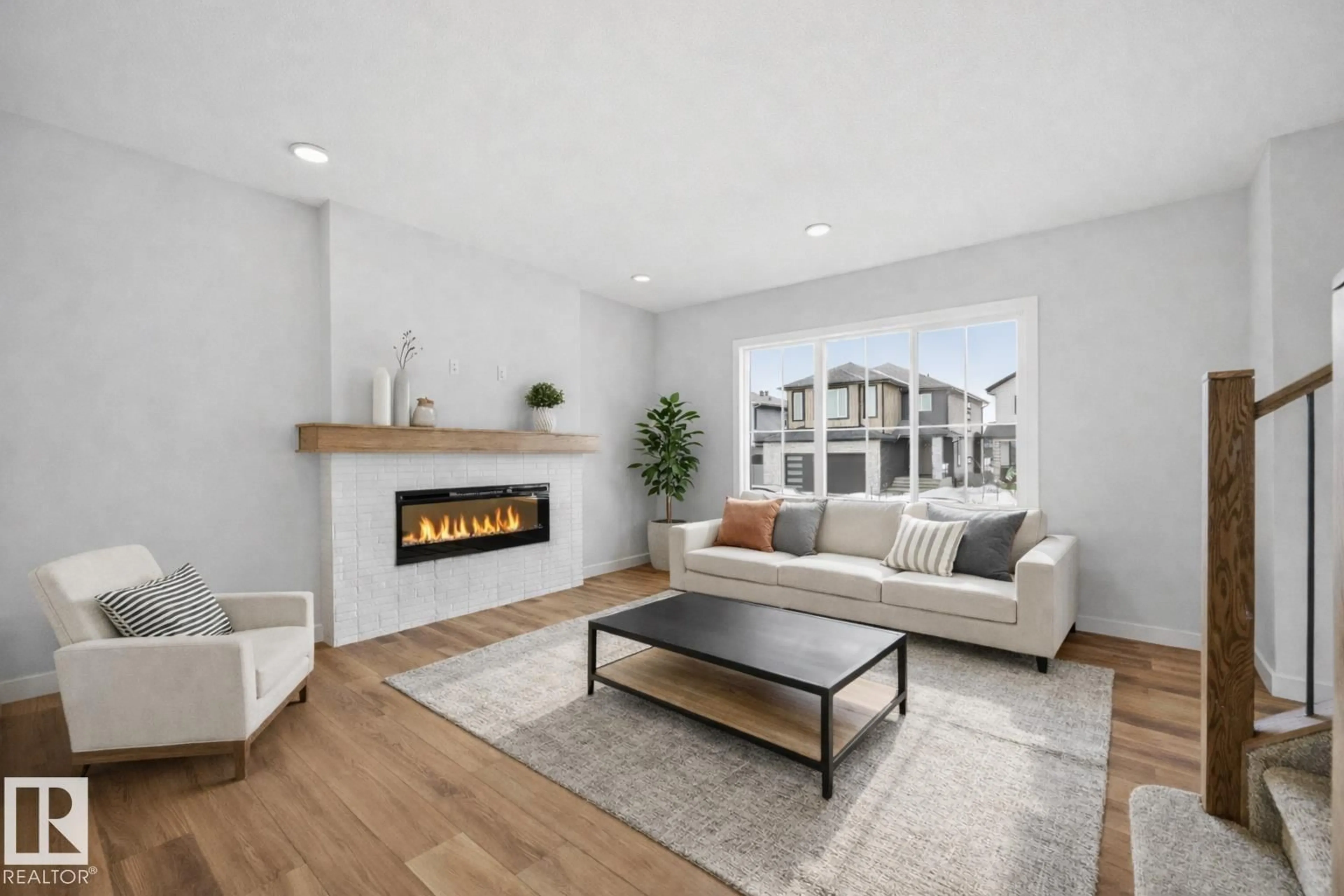 Living room with furniture, wood/laminate floor for 3266 DALLAS SCHMIDT DR, Edmonton Alberta T5E6Z8