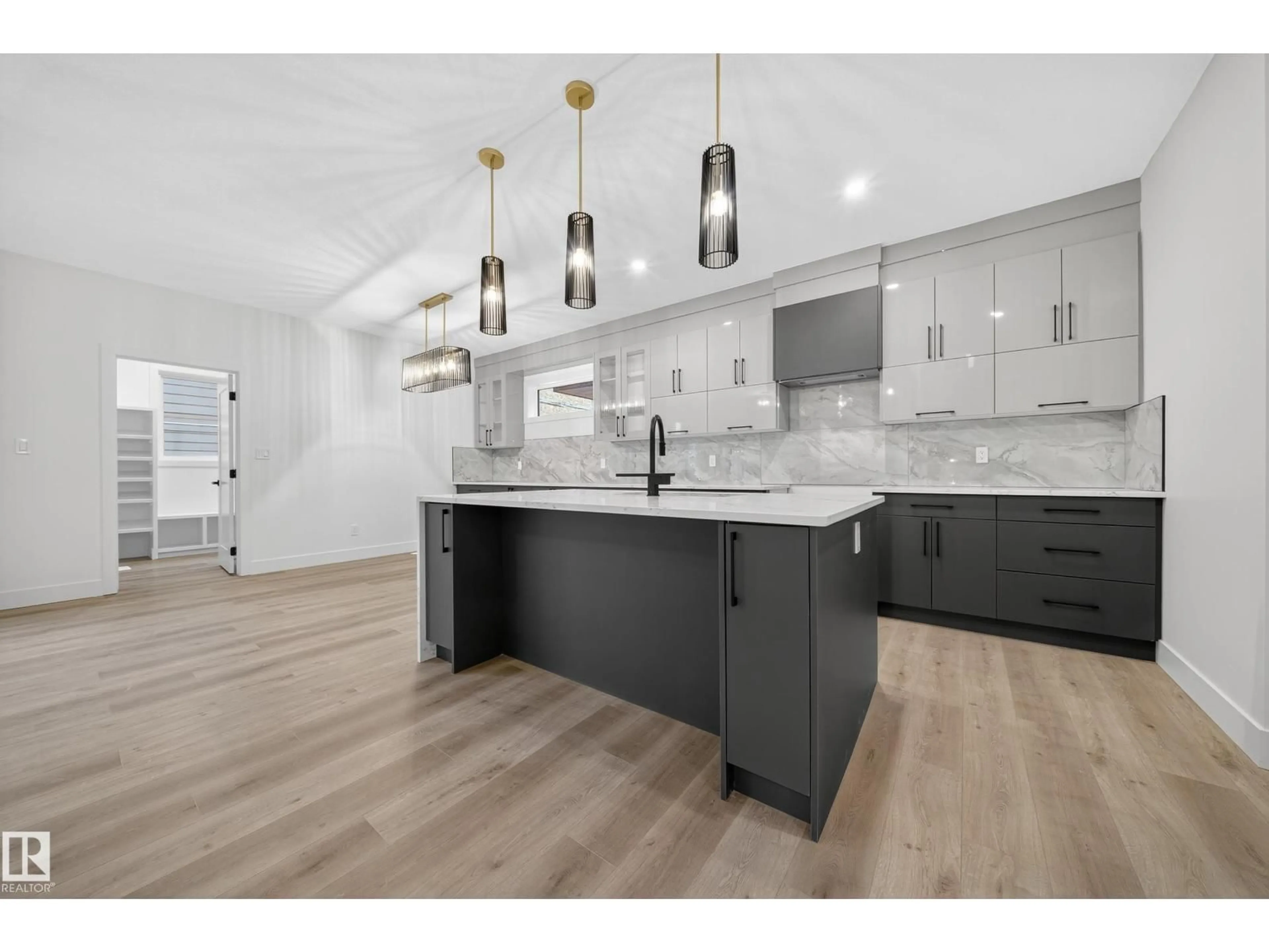 Open concept kitchen, wood/laminate floor for 6117 CRAWFORD DR, Edmonton Alberta T6W4L7