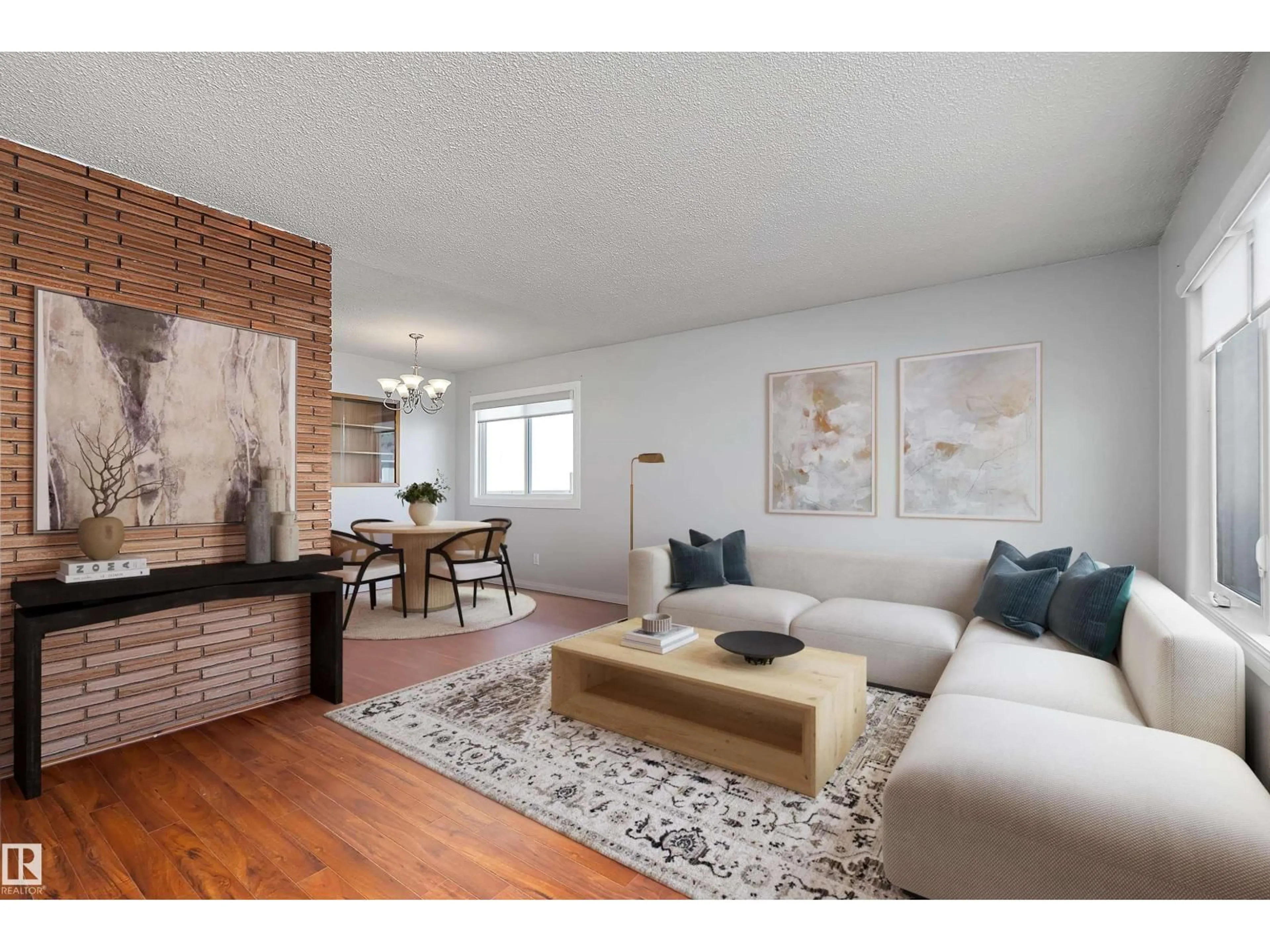 Living room with furniture, wood/laminate floor for NW - 7711 132 A AV, Edmonton Alberta T5C2C4
