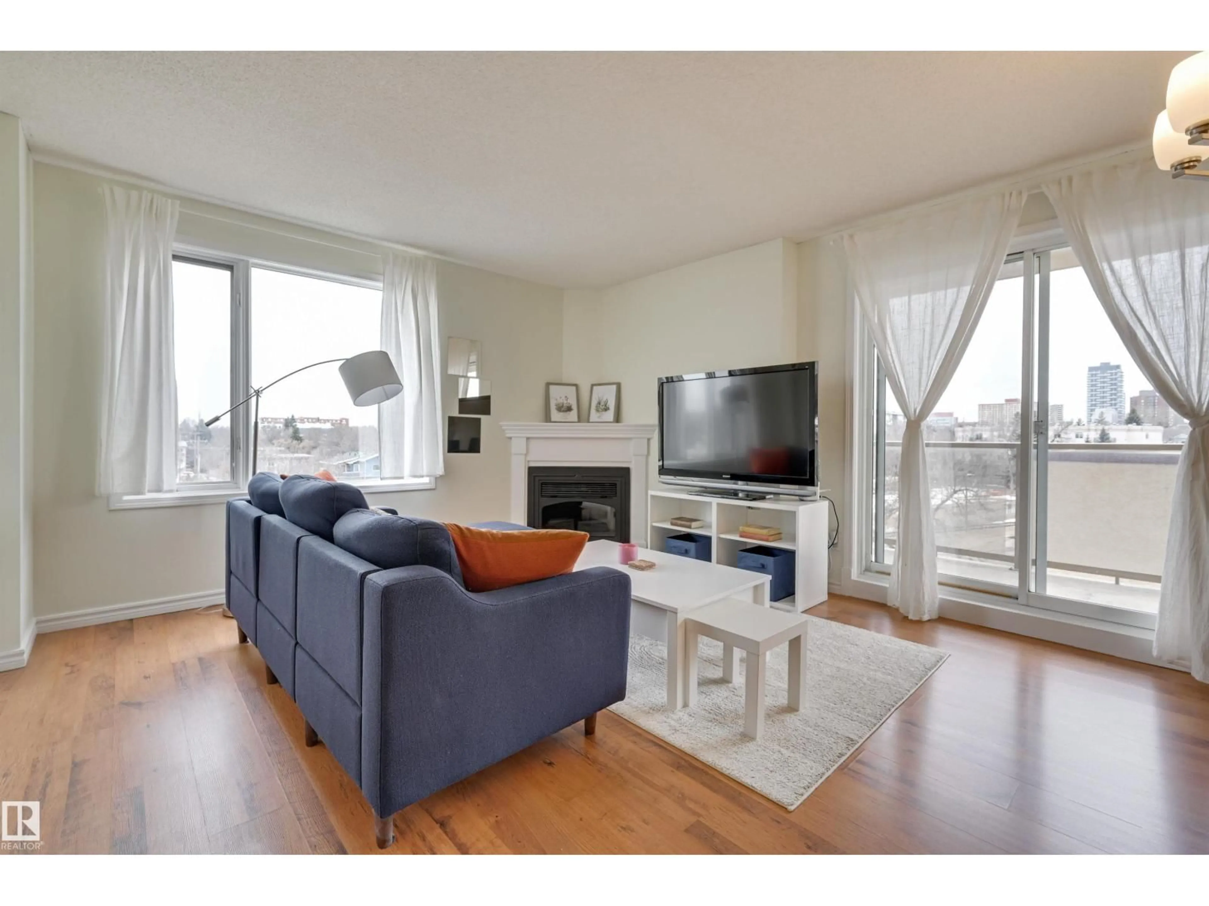 Living room with furniture, wood/laminate floor for #501 - 10649 SASKATCHEWAN DR, Edmonton Alberta T6E6S8