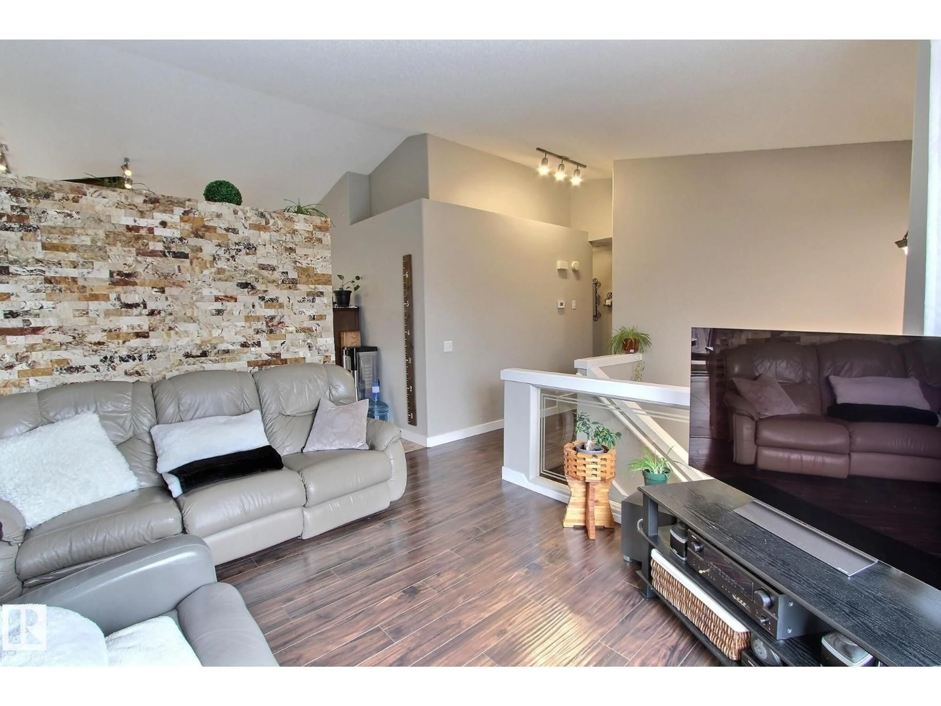 Living room with furniture, wood/laminate floor for 12 BELFRY FAIRWAY, Stony Plain Alberta T7Z2M8