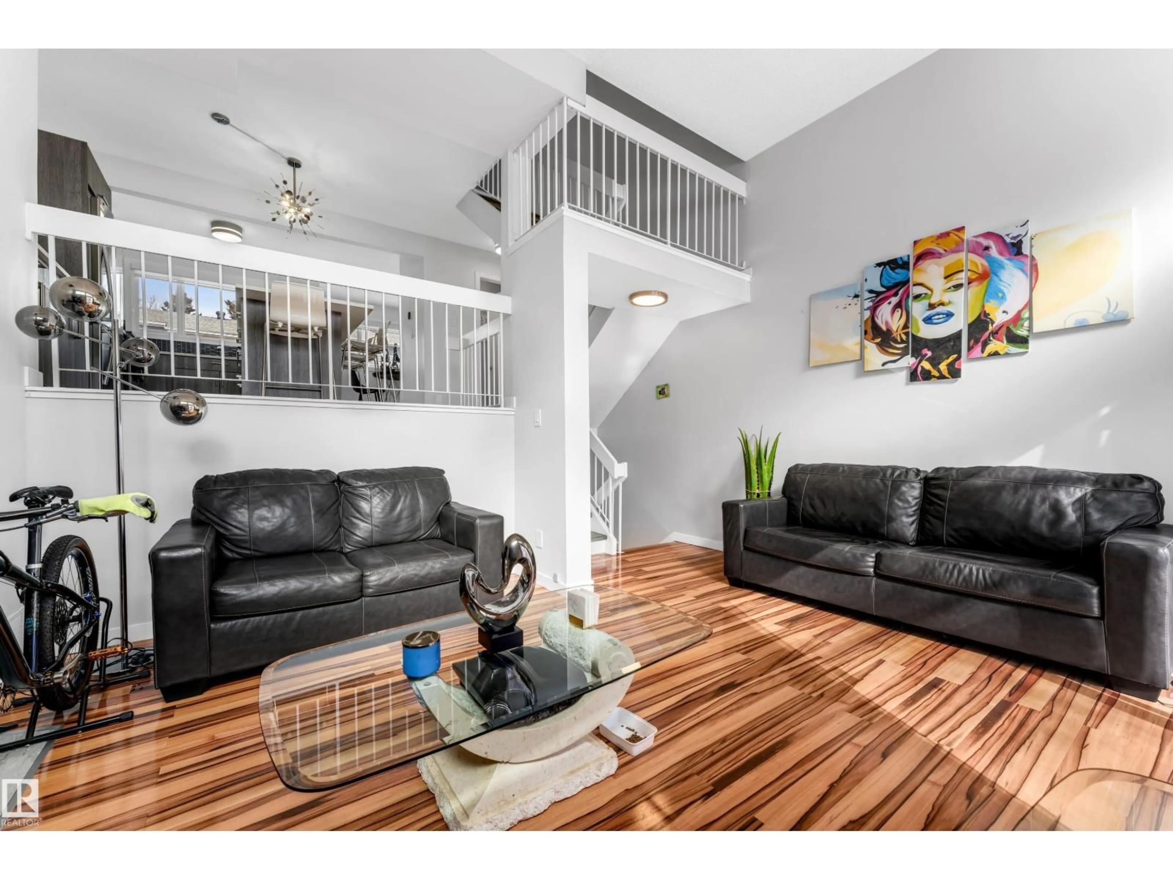 Living room with furniture, wood/laminate floor for 1009 MILLBOURNE ROAD, Edmonton Alberta T6K0T2