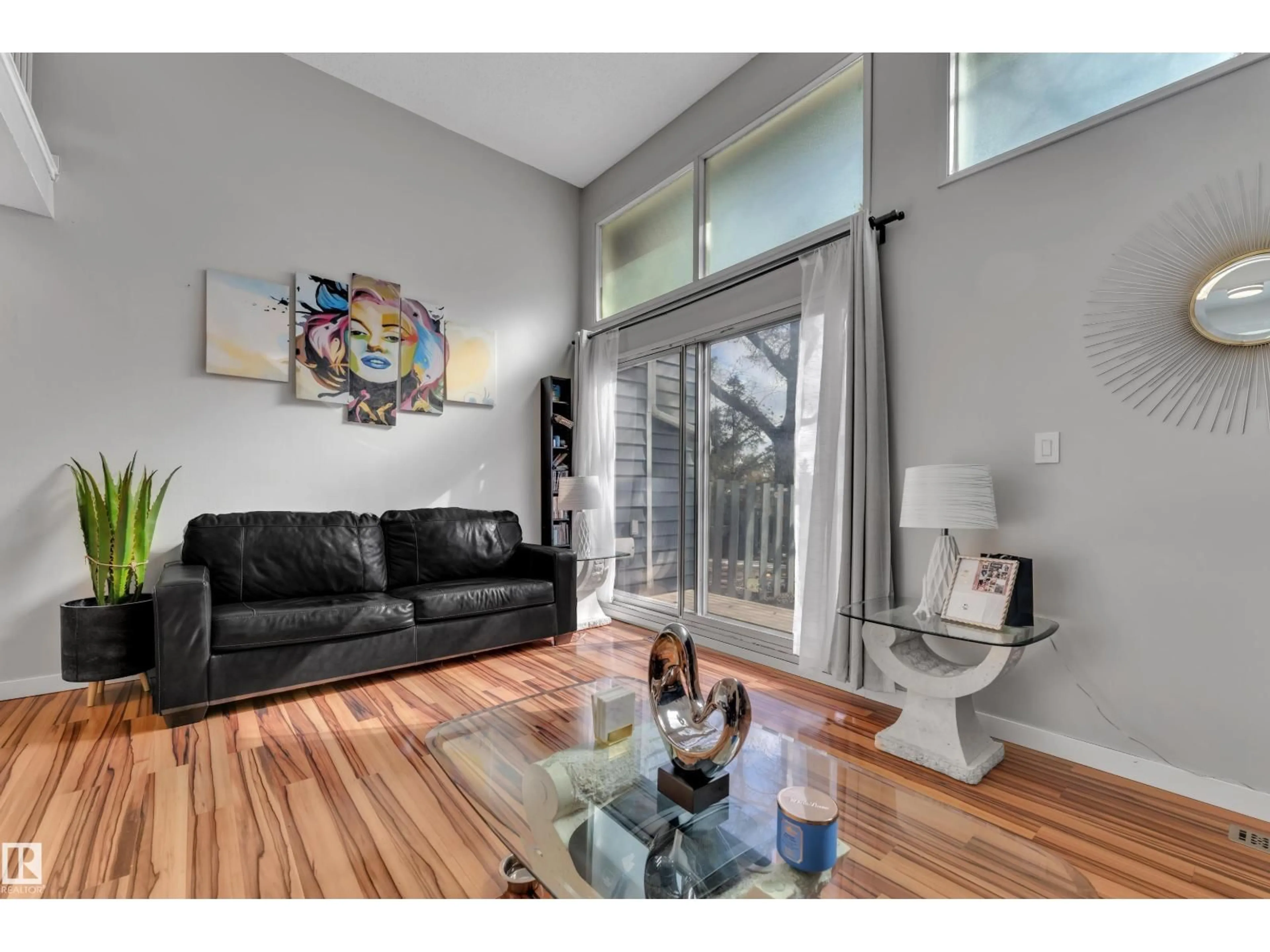 Living room with furniture, wood/laminate floor for 1009 MILLBOURNE ROAD, Edmonton Alberta T6K0T2