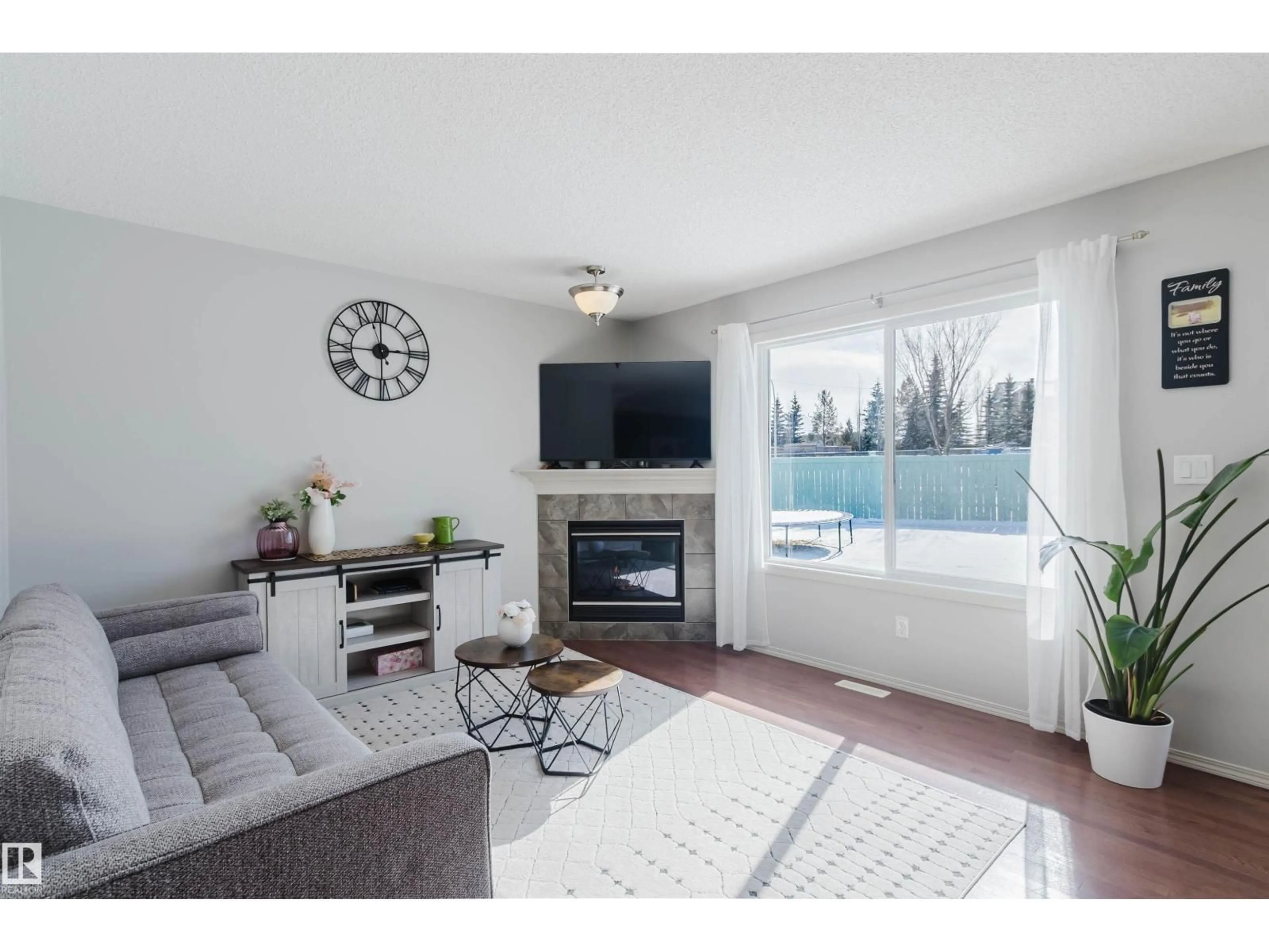 Living room with furniture, wood/laminate floor for 2349 LEMIEUX PL, Edmonton Alberta T6R0C3
