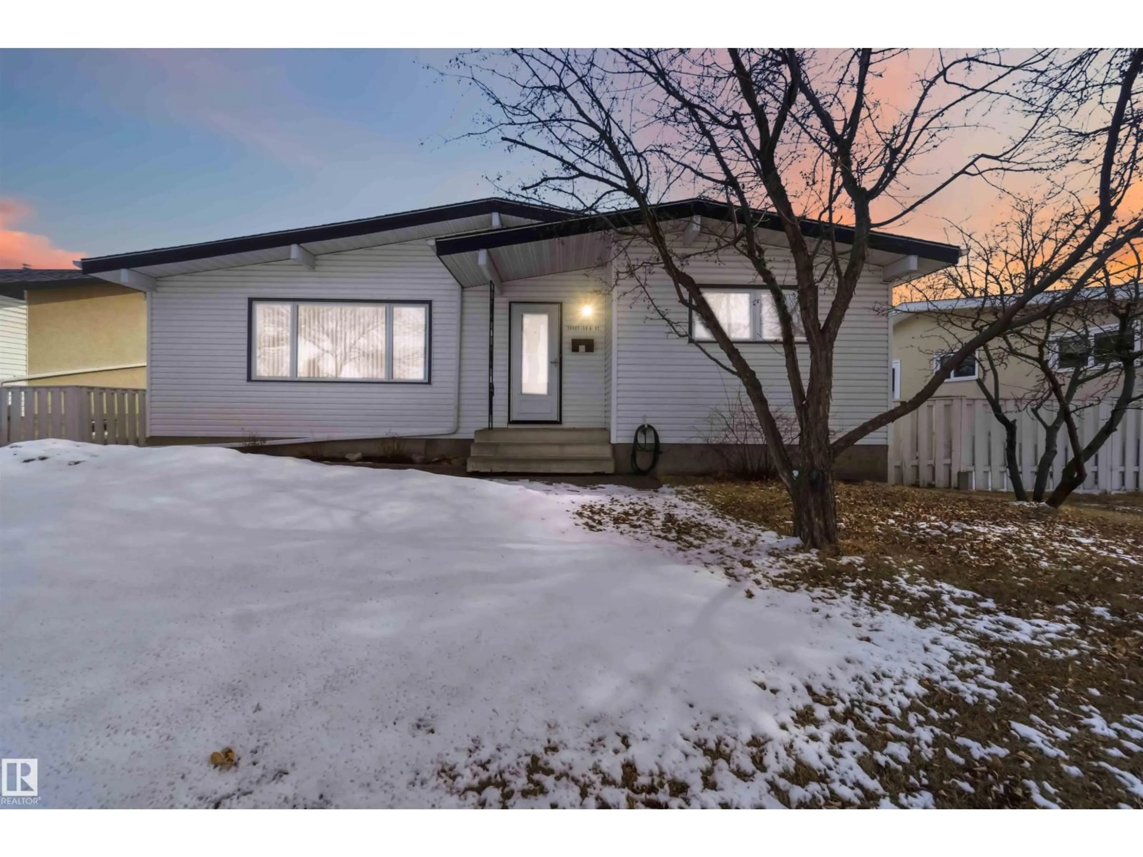 Home with vinyl exterior material, street for 15007 59A ST NW, Edmonton Alberta T5A1Z1