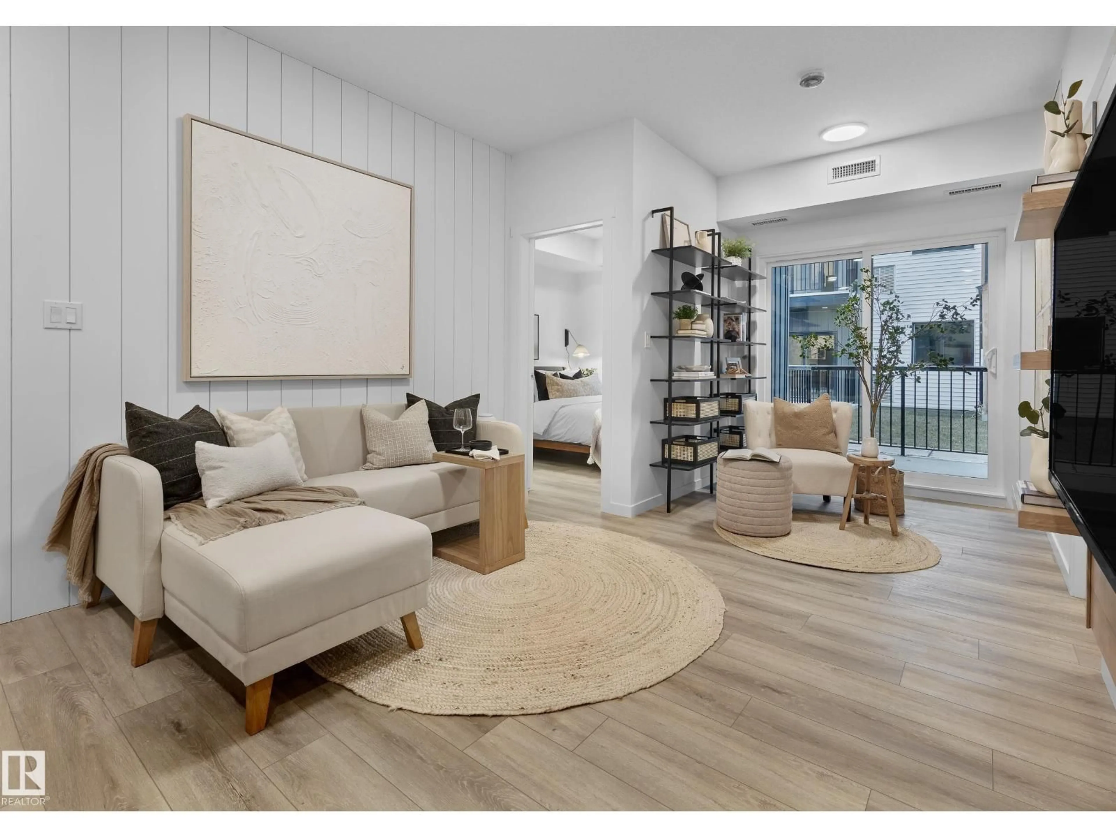 Living room with furniture, wood/laminate floor for #104 - 3715 141 ST, Edmonton Alberta T6W5M9