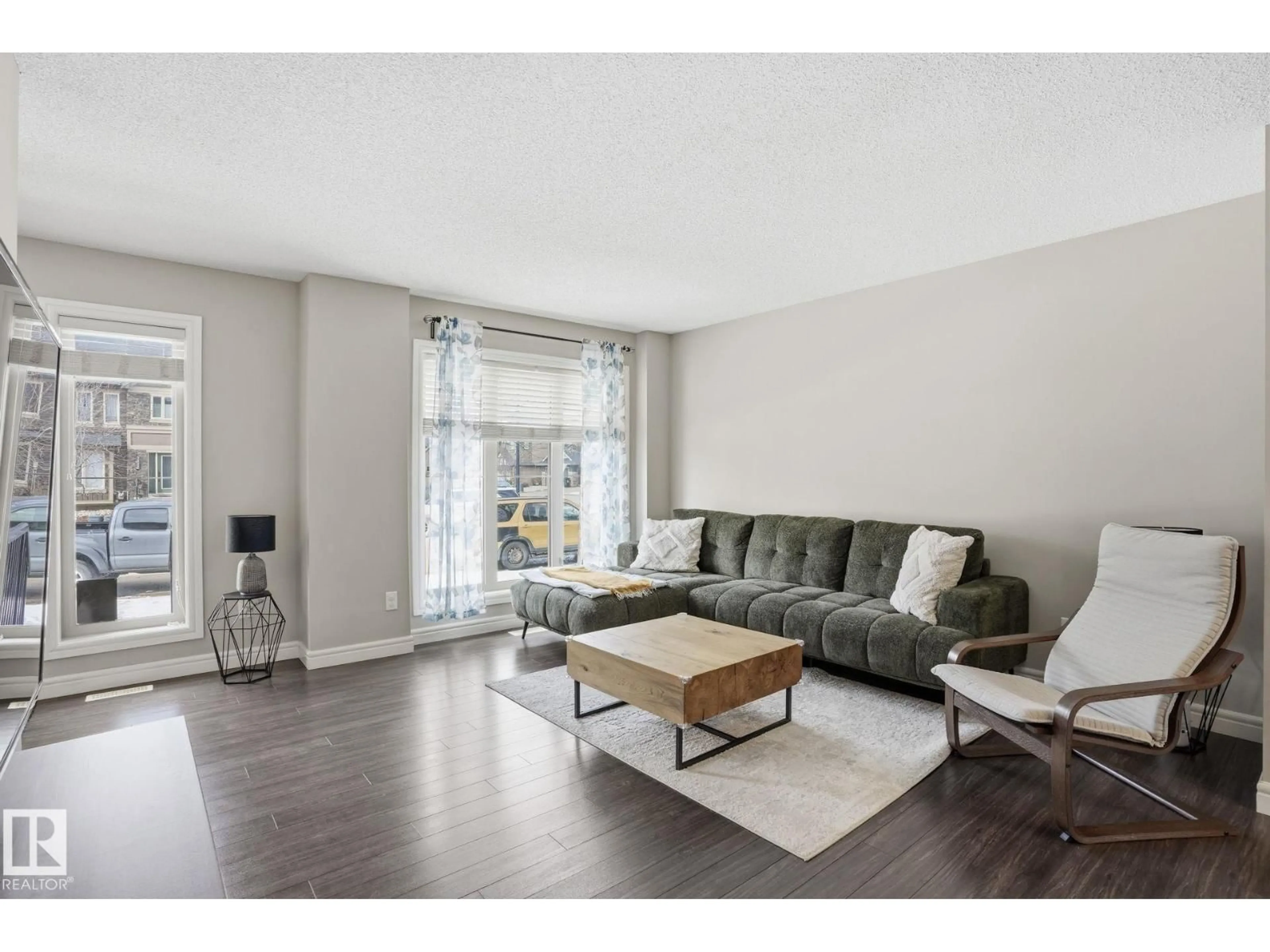 Living room with furniture, wood/laminate floor for SW - 3057 KESWICK WY, Edmonton Alberta T6W2R2