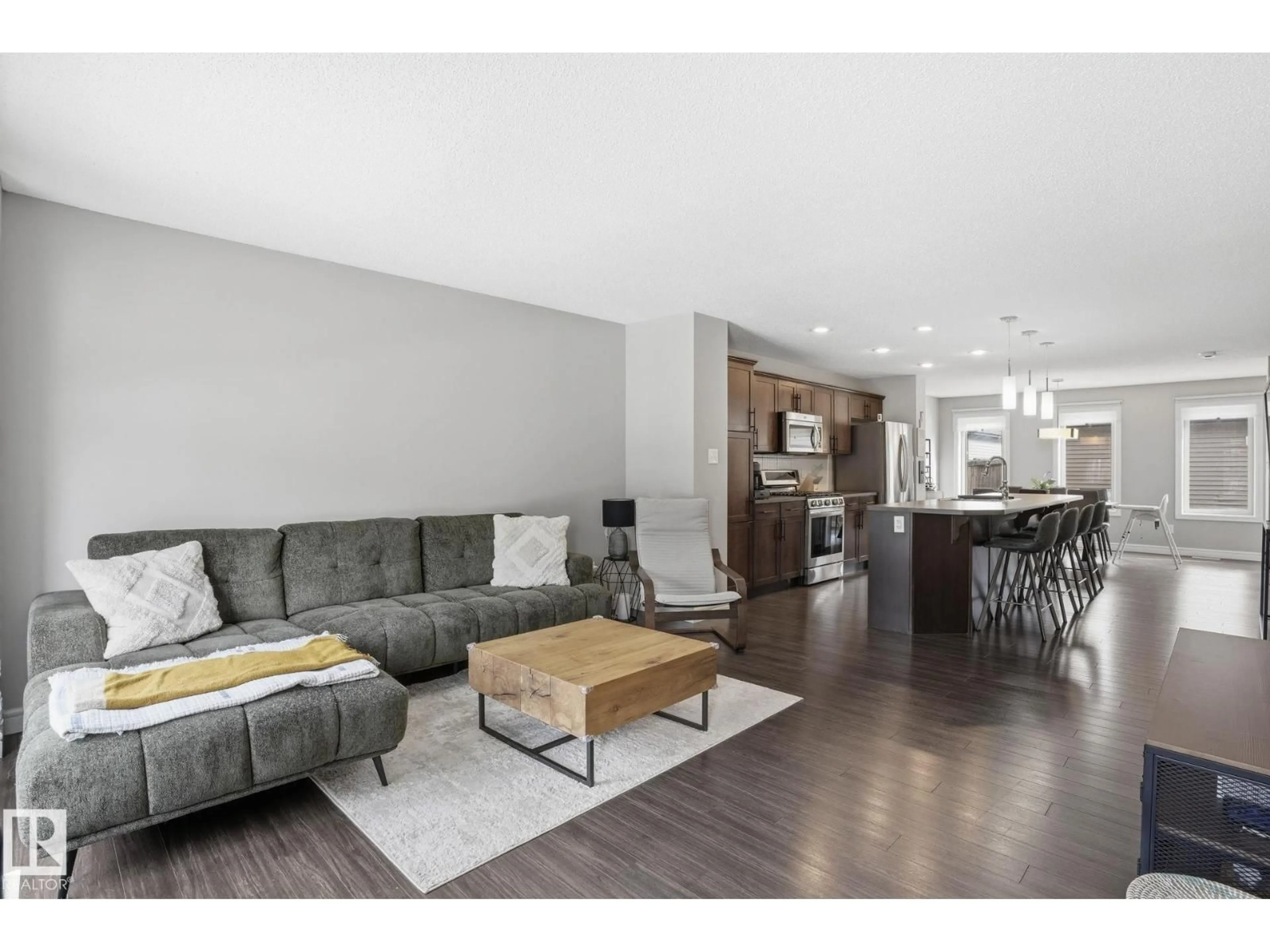 Living room with furniture, wood/laminate floor for SW - 3057 KESWICK WY, Edmonton Alberta T6W2R2