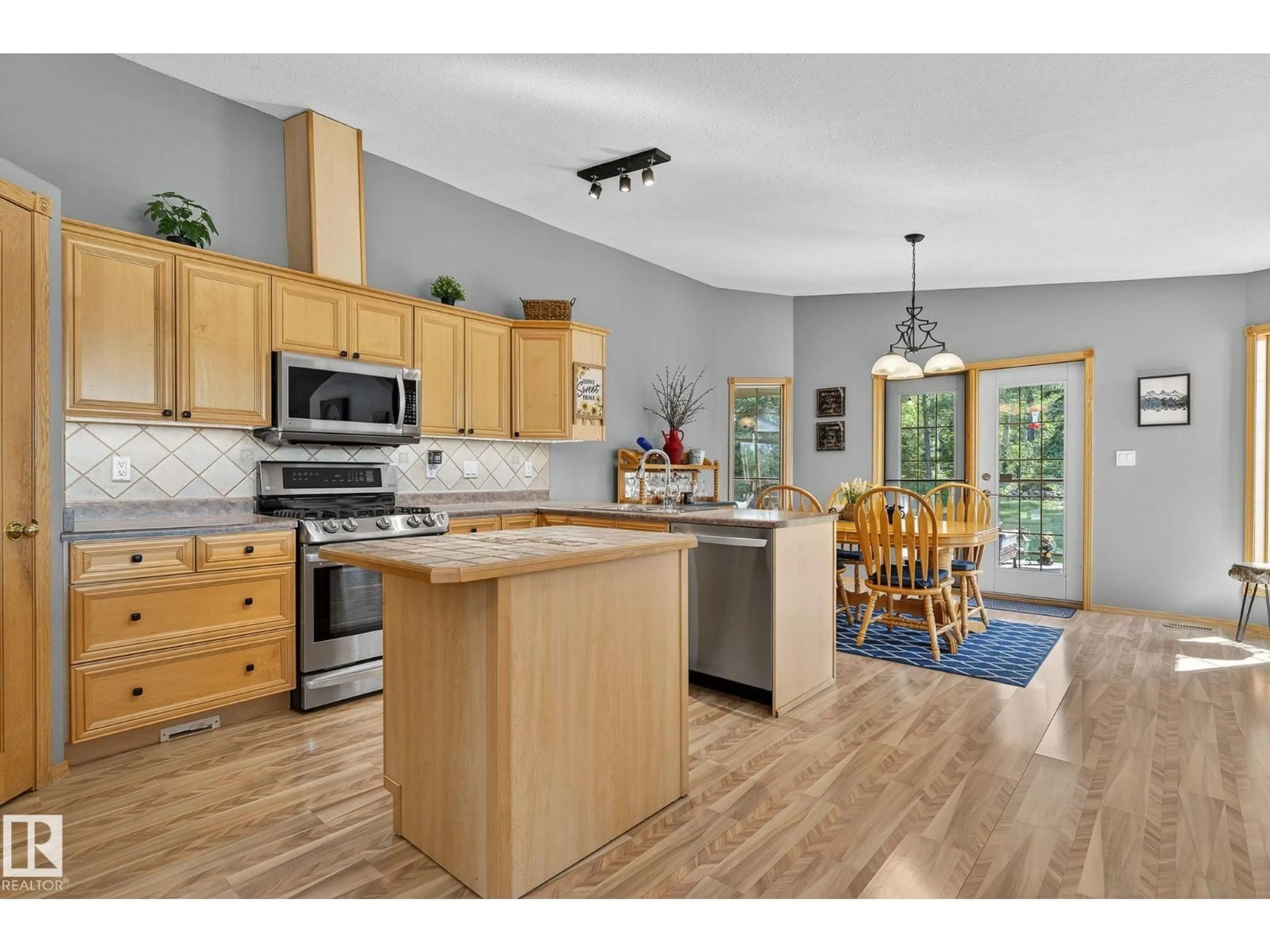 Open concept kitchen, wood/laminate floor for 4002 SCOTT AV, Rural Wetaskiwin County Alberta T0C2C0