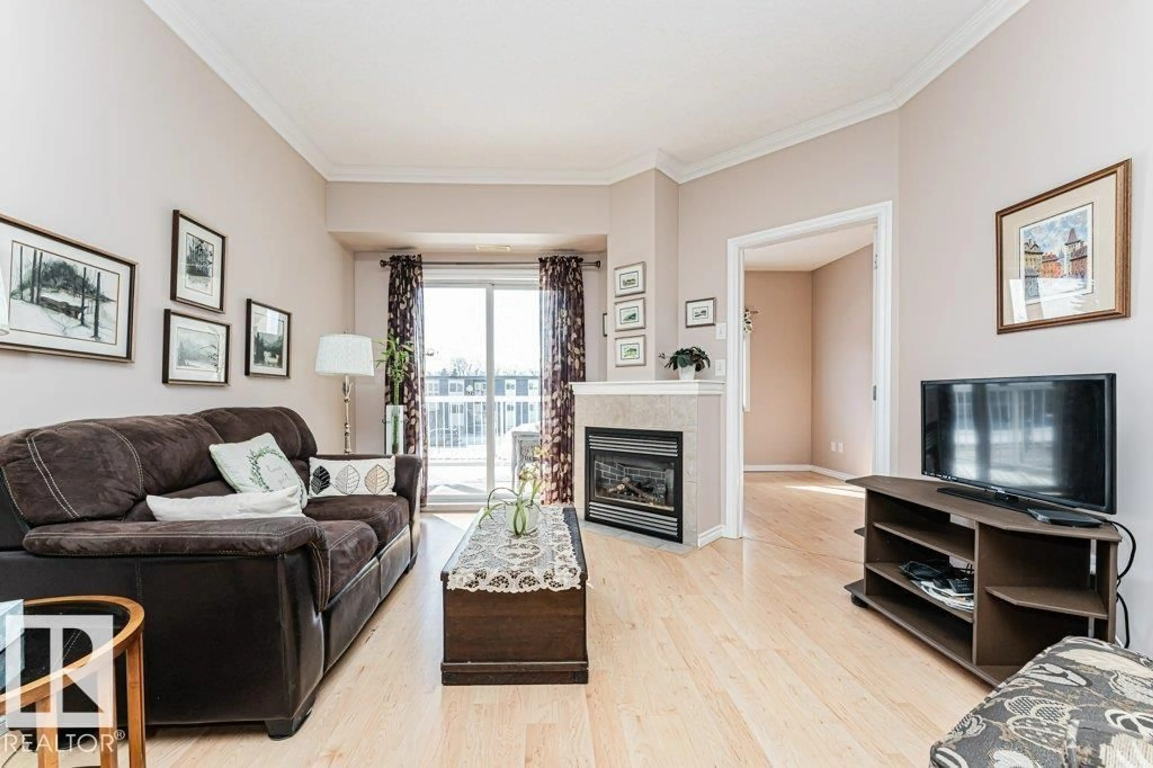 Living room with furniture, wood/laminate floor for #206 - 8528 82 AV, Edmonton Alberta T6C0Y8