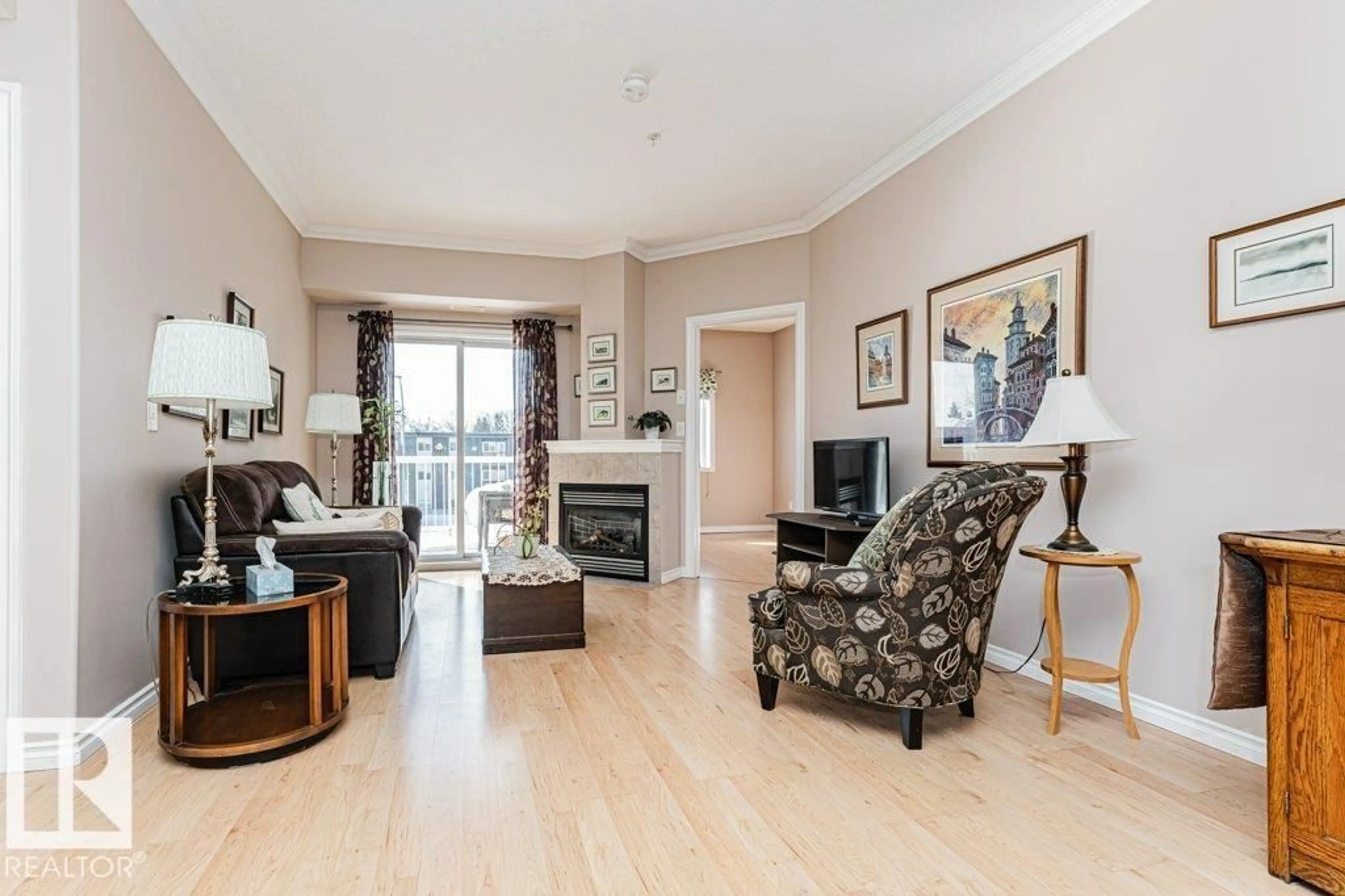 Living room with furniture, wood/laminate floor for #206 - 8528 82 AV, Edmonton Alberta T6C0Y8