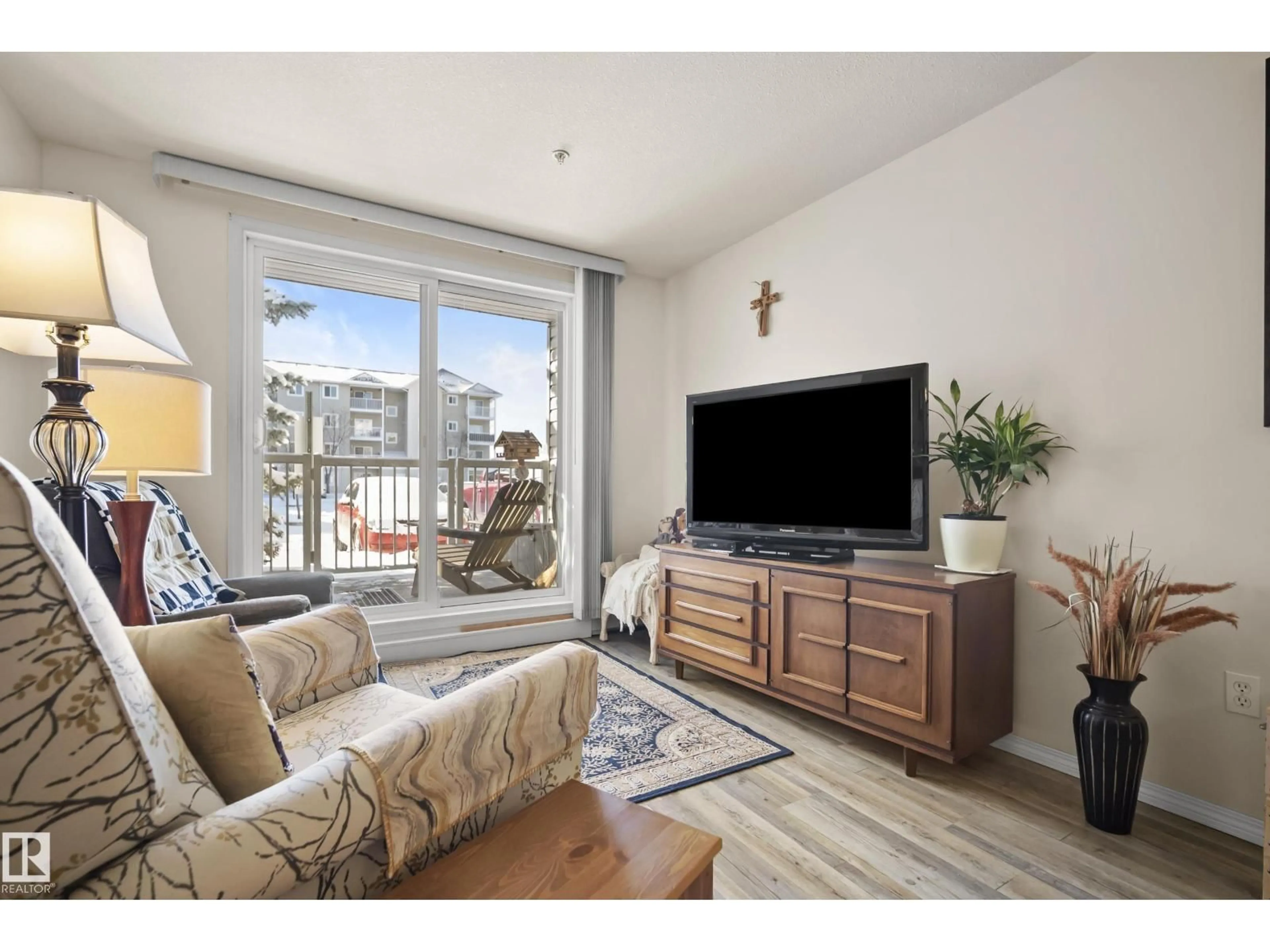 Living room with furniture, wood/laminate floor for 128 - 4309 33 33 ST, Stony Plain Alberta T7Z0C4