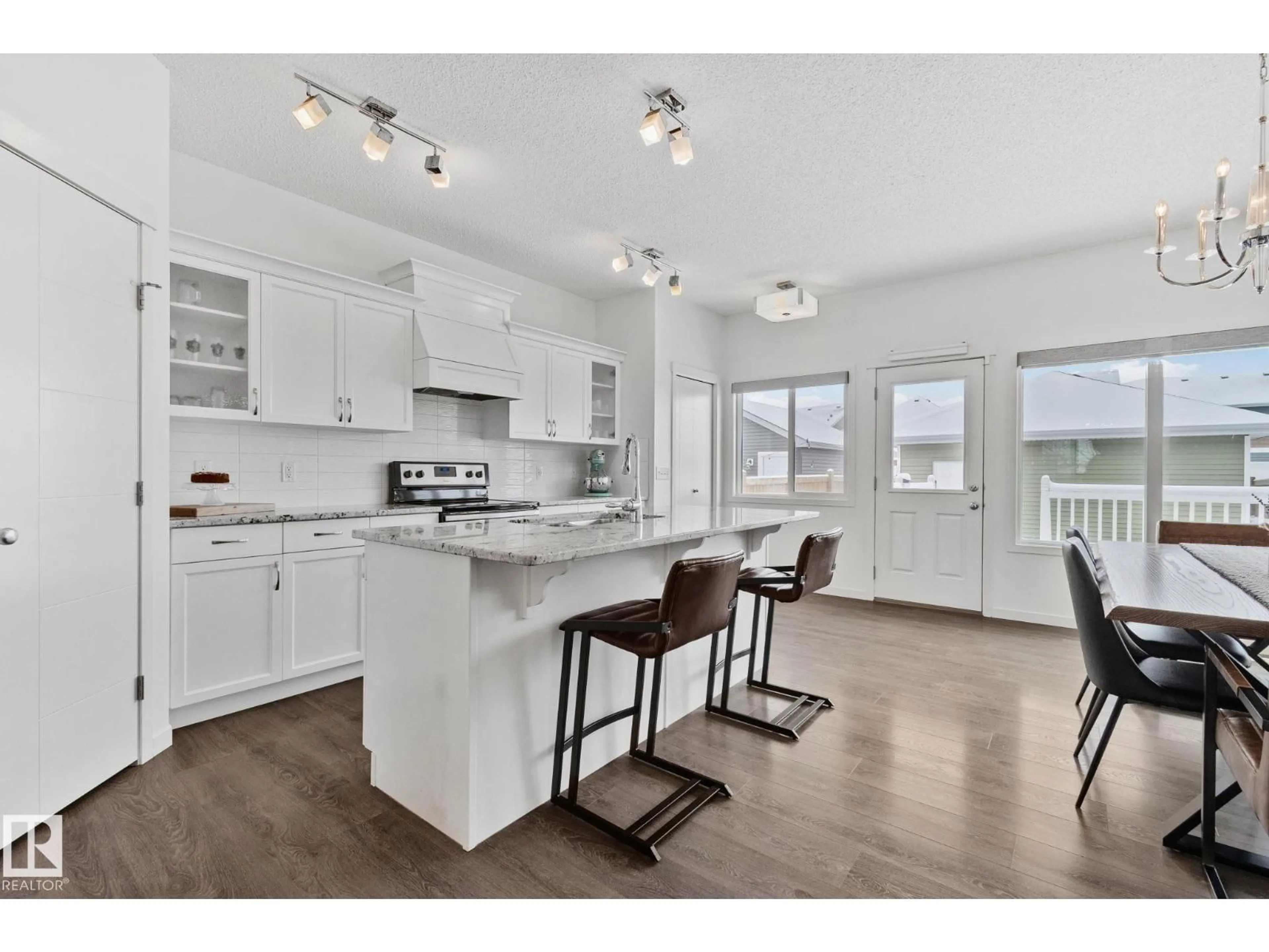 Open concept kitchen, wood/laminate floor for 540 EBBERS WY, Edmonton Alberta T5Y3T8