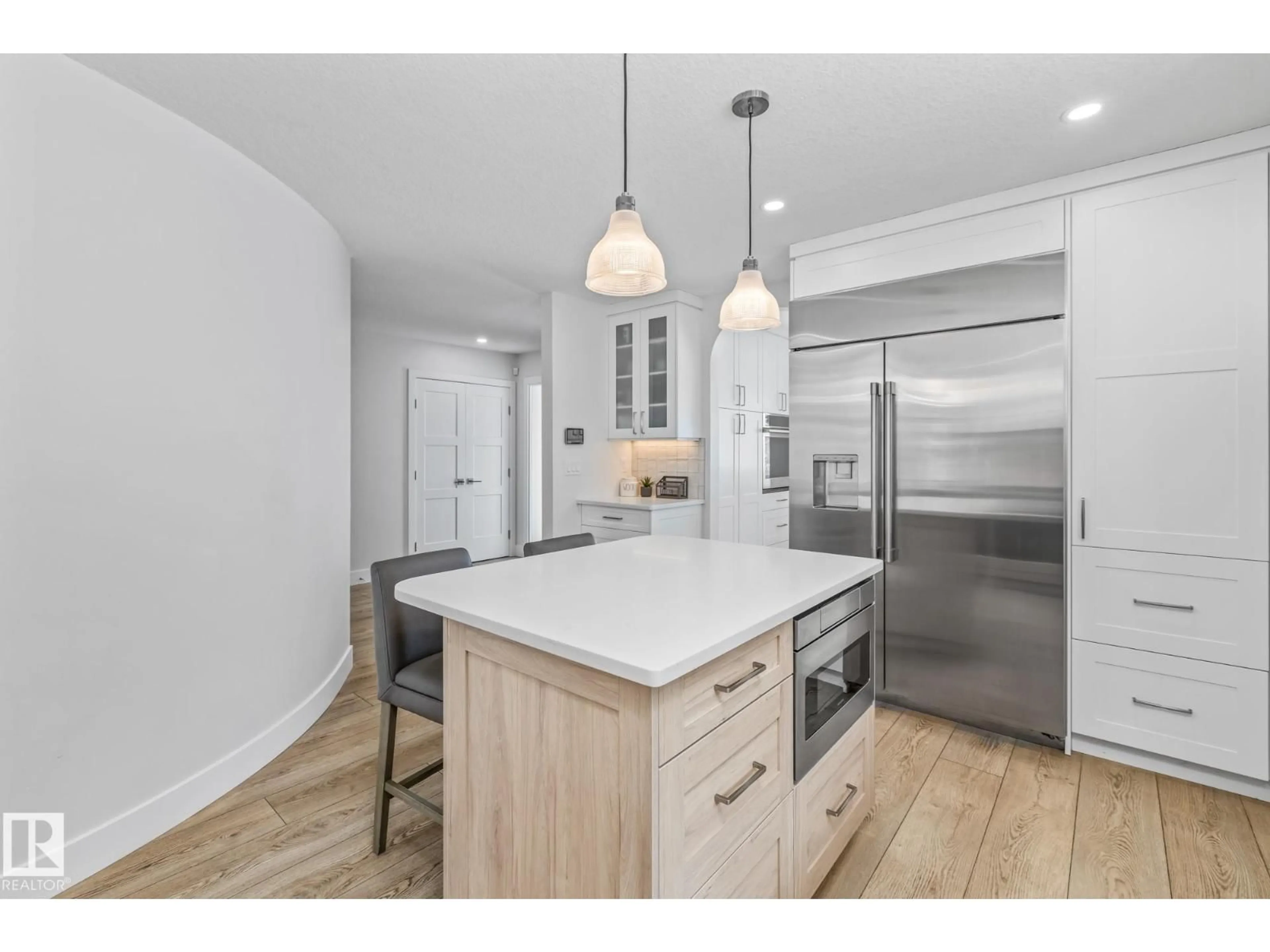 Open concept kitchen, wood/laminate floor for 31 - 54324 BELLEROSE DR, Rural Sturgeon County Alberta T8T0C5