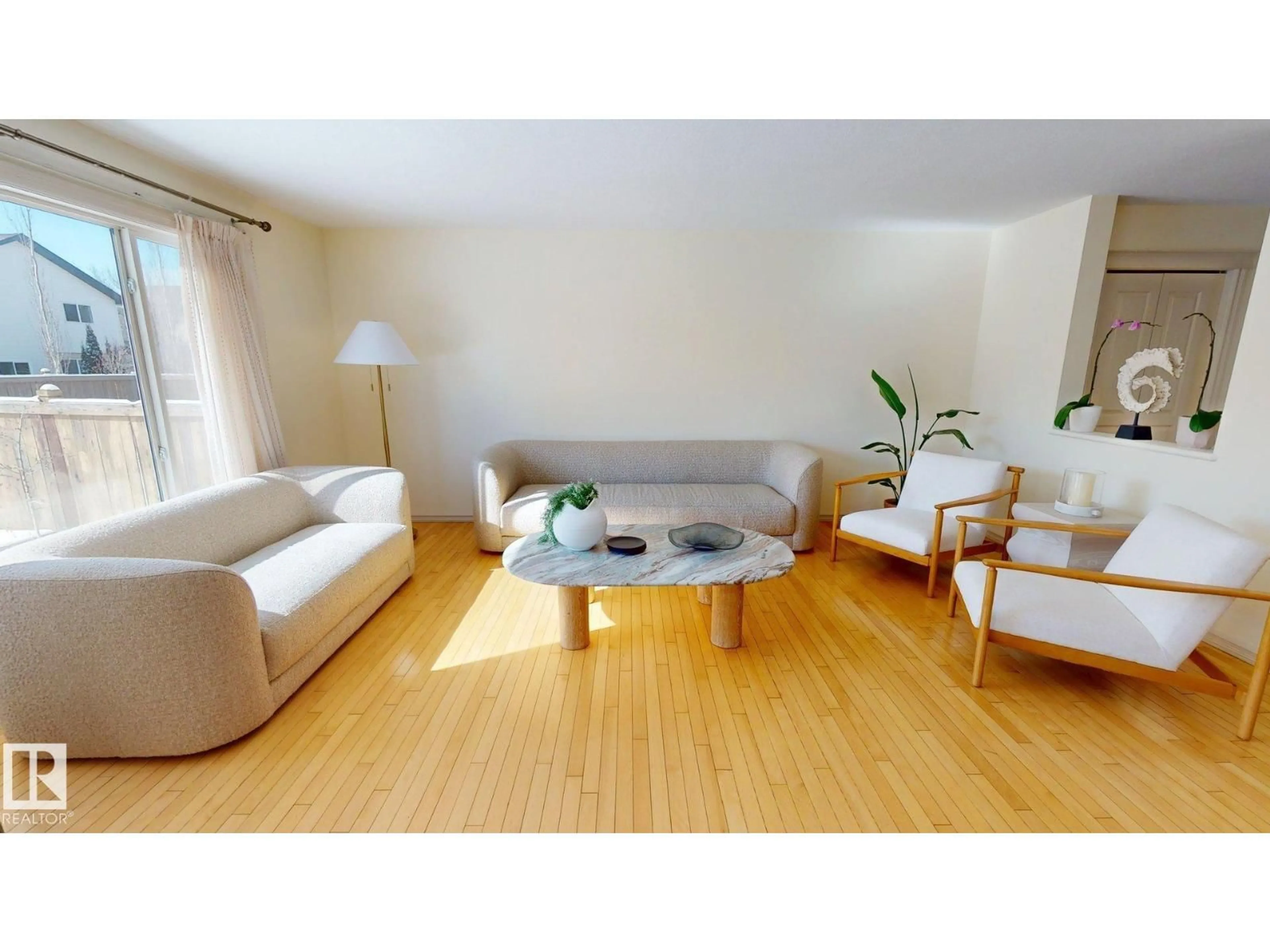 Living room with furniture, wood/laminate floor for 1609 HODGSON CT, Edmonton Alberta T6R3R5