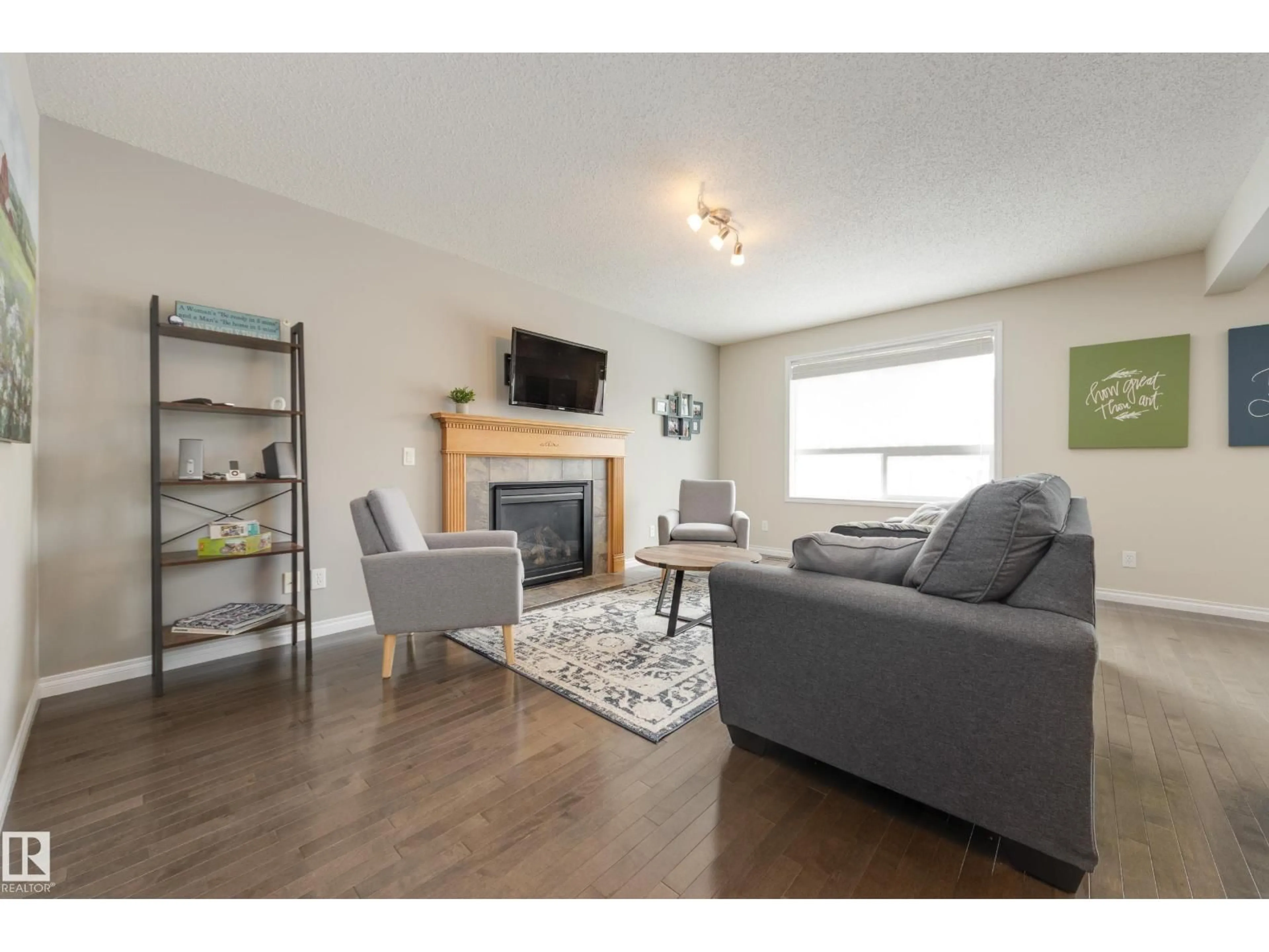 Living room with furniture, wood/laminate floor for 14 LANDON CR, Spruce Grove Alberta T7X0E4