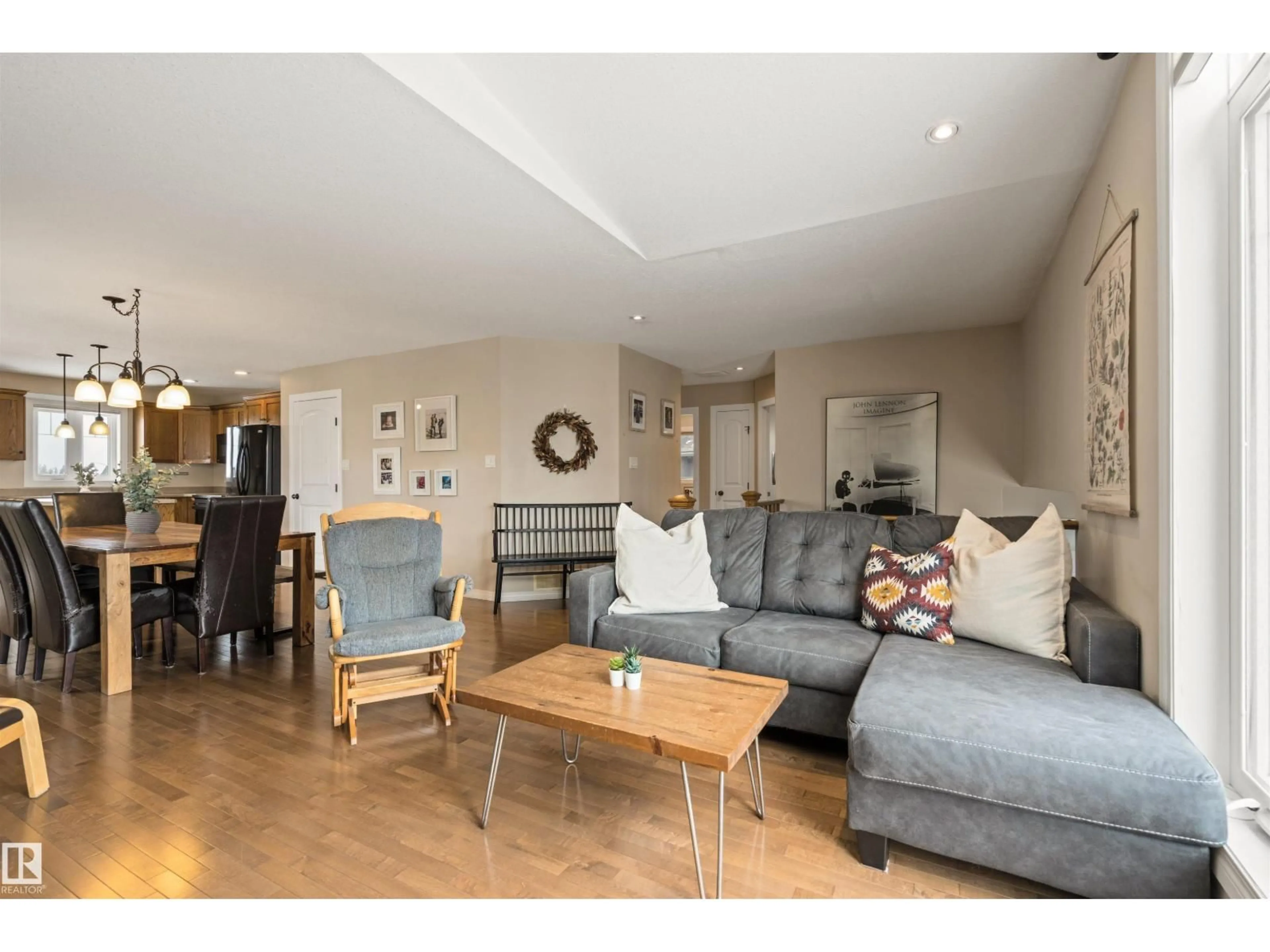 Living room with furniture, wood/laminate floor for 116 LOGPERCH CR, Cold Lake Alberta T9M0B3