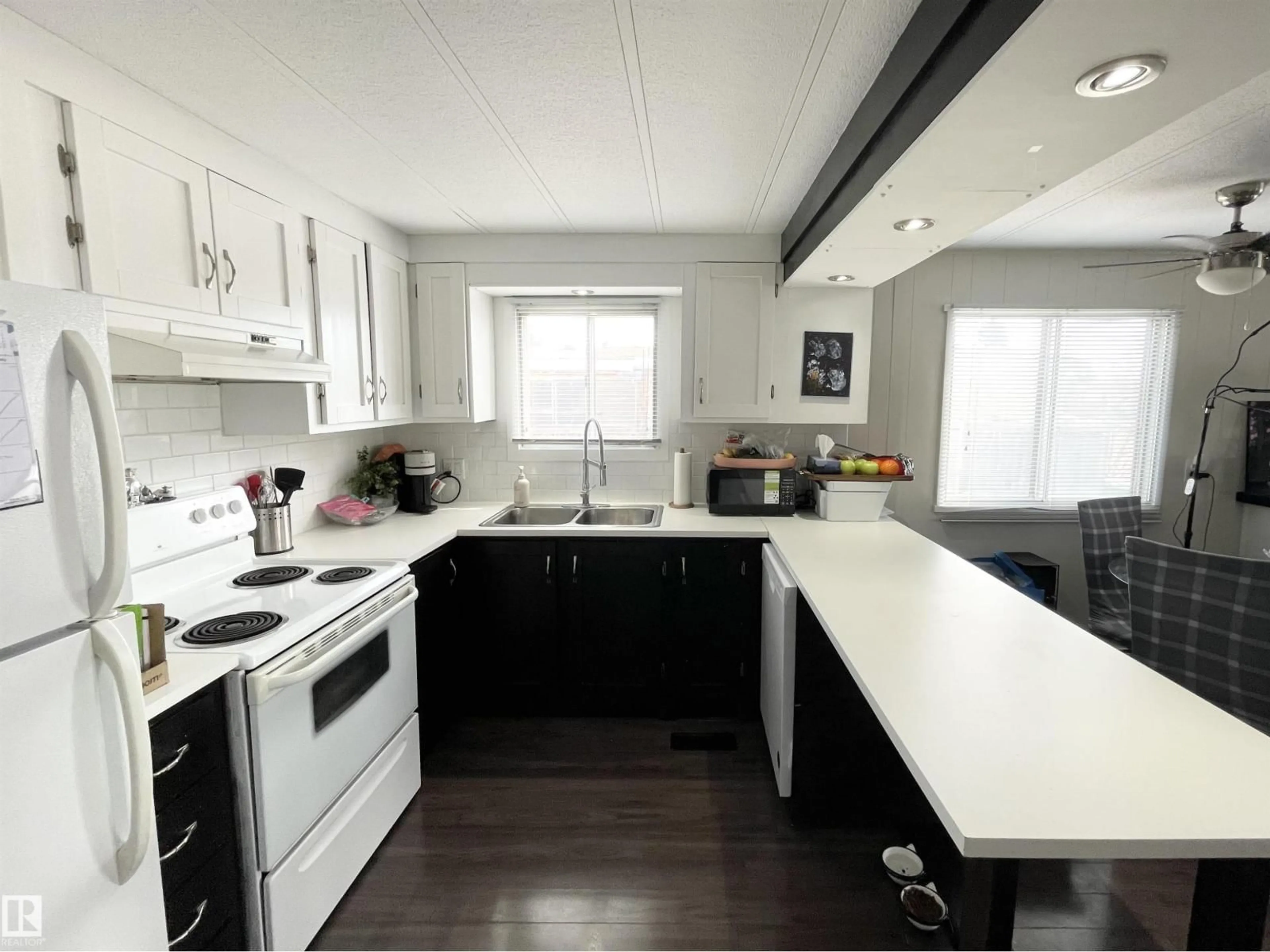 Open concept kitchen, wood/laminate floor for 4908 55 AVENUE, Camrose Alberta T4V3A4