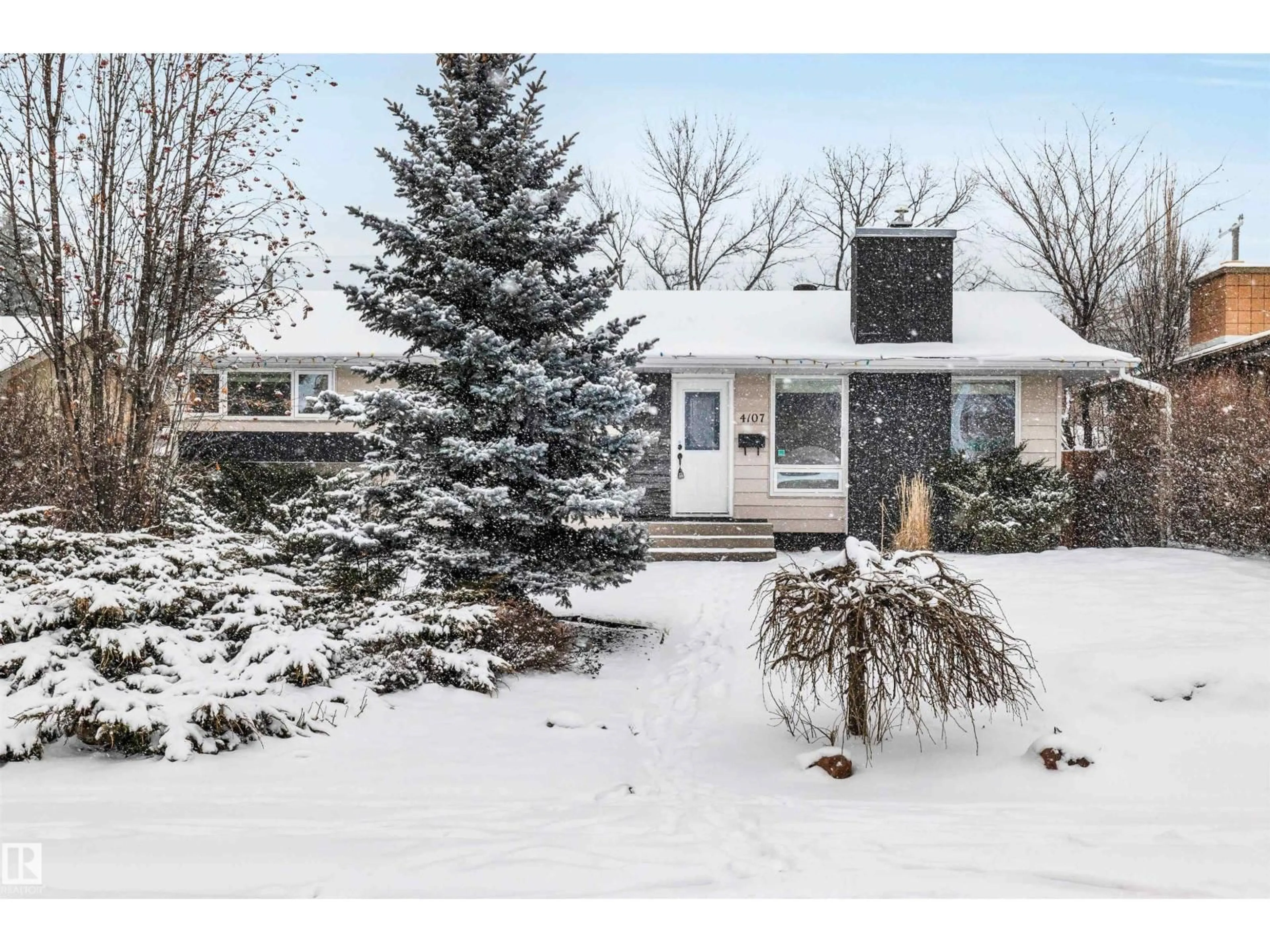 Home with vinyl exterior material, street for 4107 122 ST, Edmonton Alberta T6J1Z1