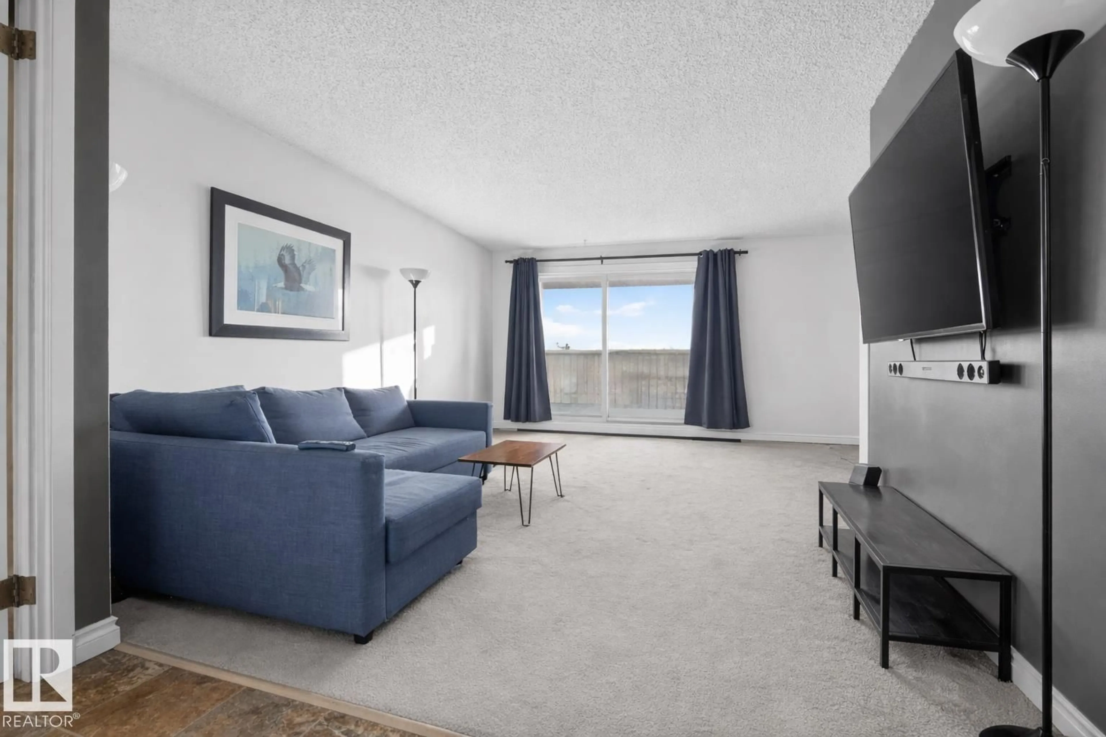 Living room with furniture, carpet floor for #407 - 5125 RIVERBEND RD, Edmonton Alberta T6H5K5