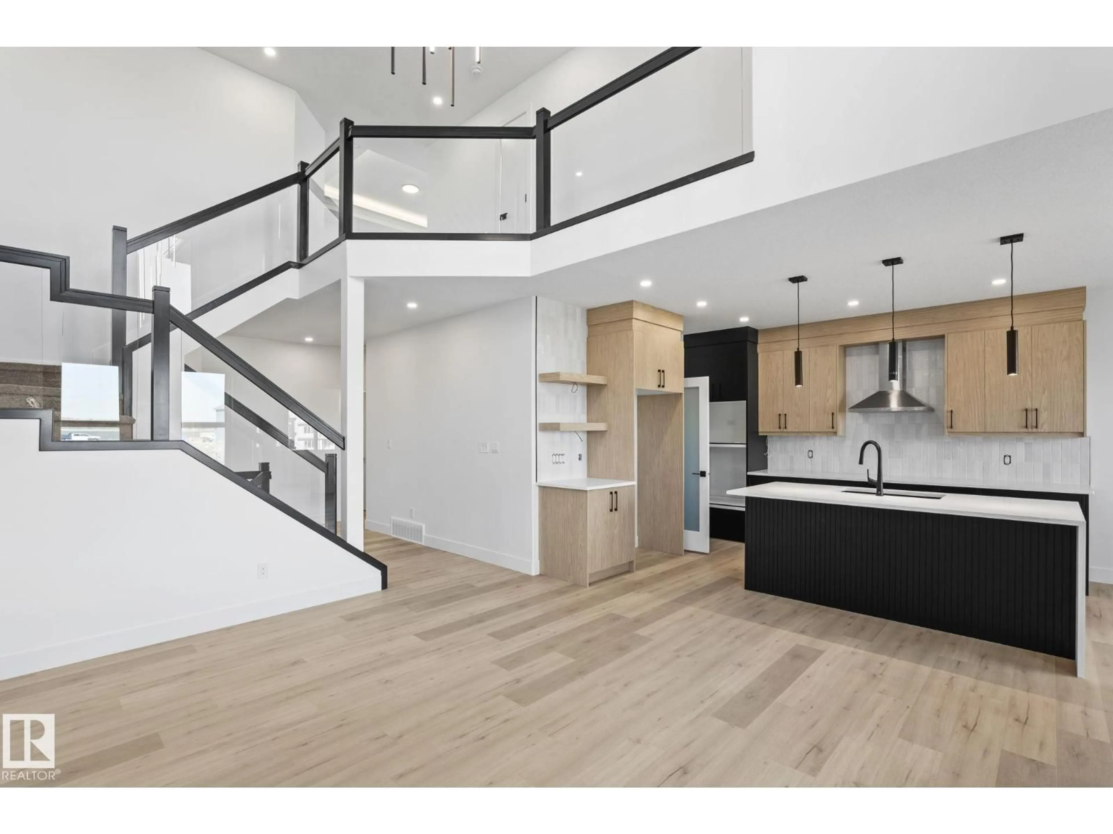 Open concept kitchen, wood/laminate floor for 8516 181 AV, Edmonton Alberta T5Z0X1