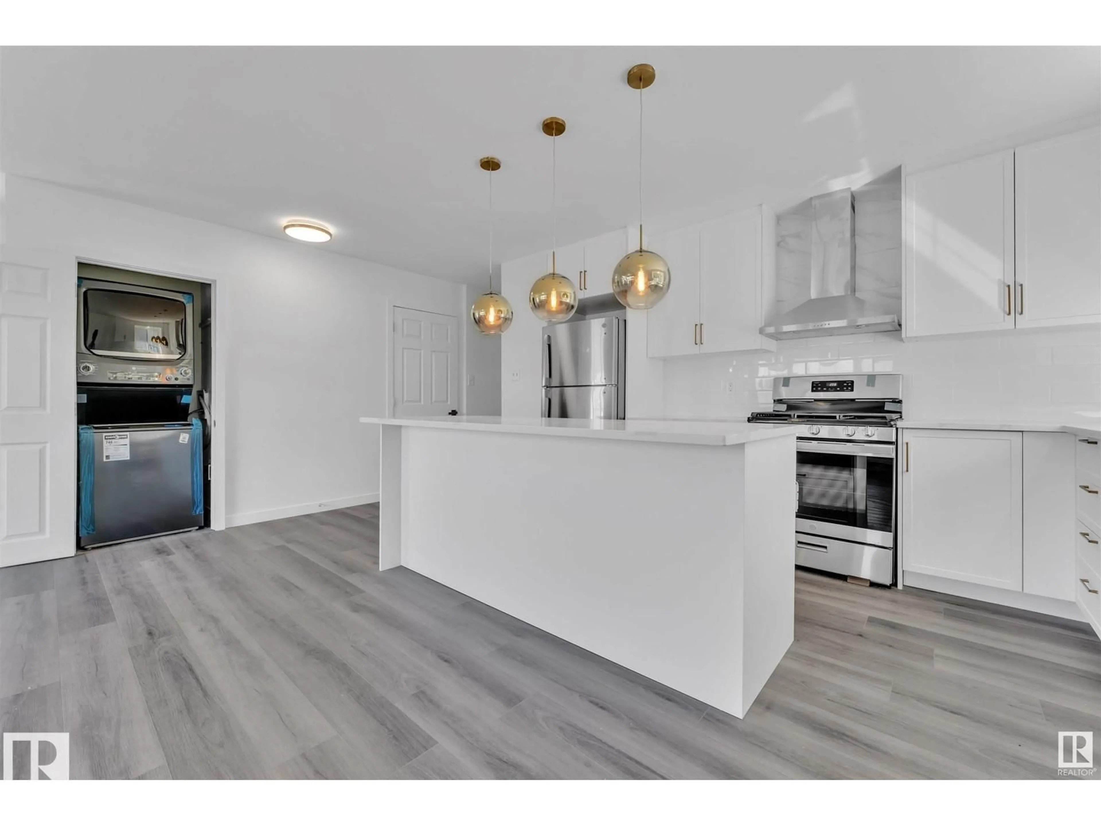 Open concept kitchen, wood/laminate floor for 8004 130 AV, Edmonton Alberta T5C1Y5