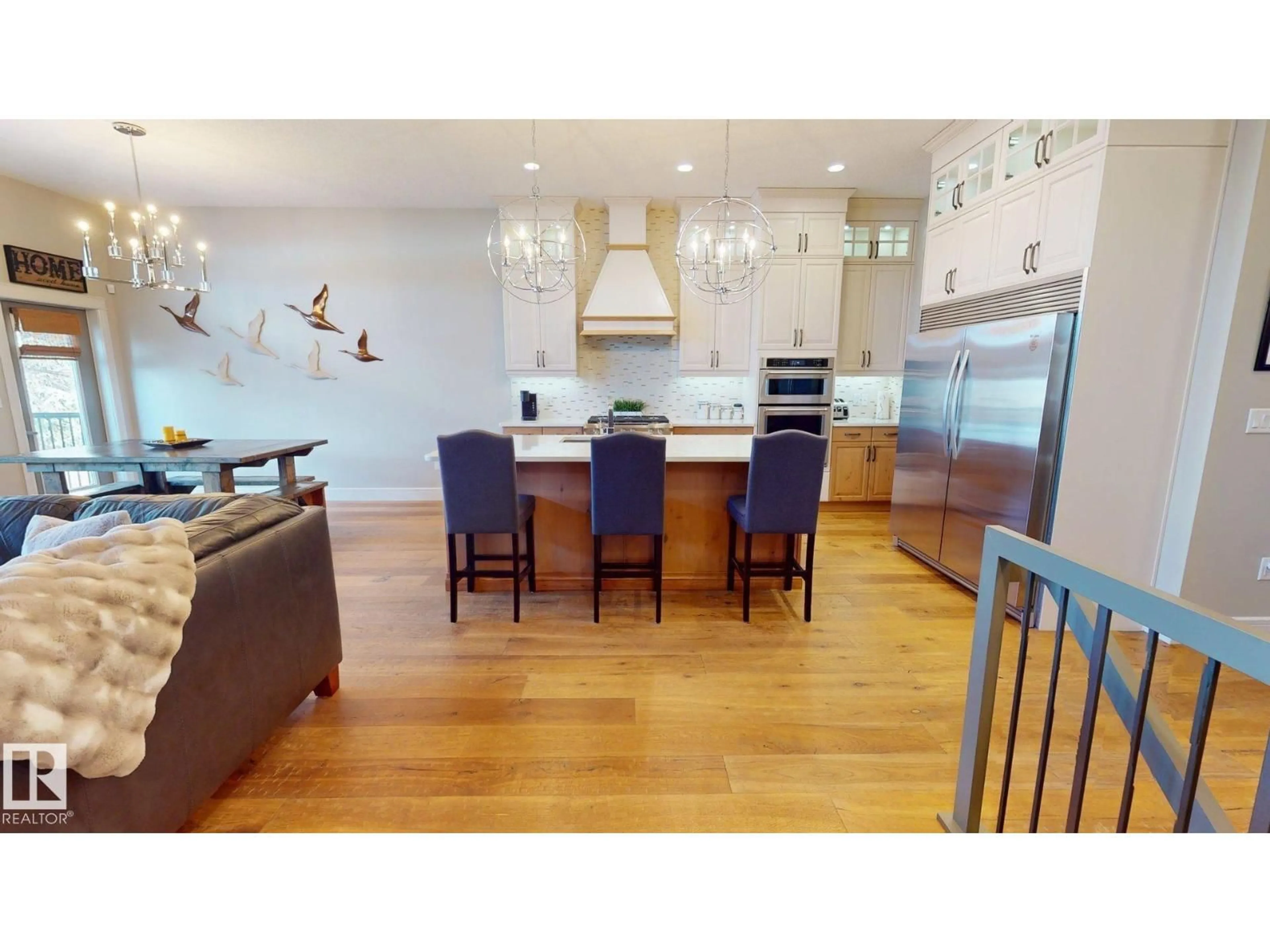 Open concept kitchen, wood/laminate floor for 62 KENTON WOODS LN, Spruce Grove Alberta T7X0P8