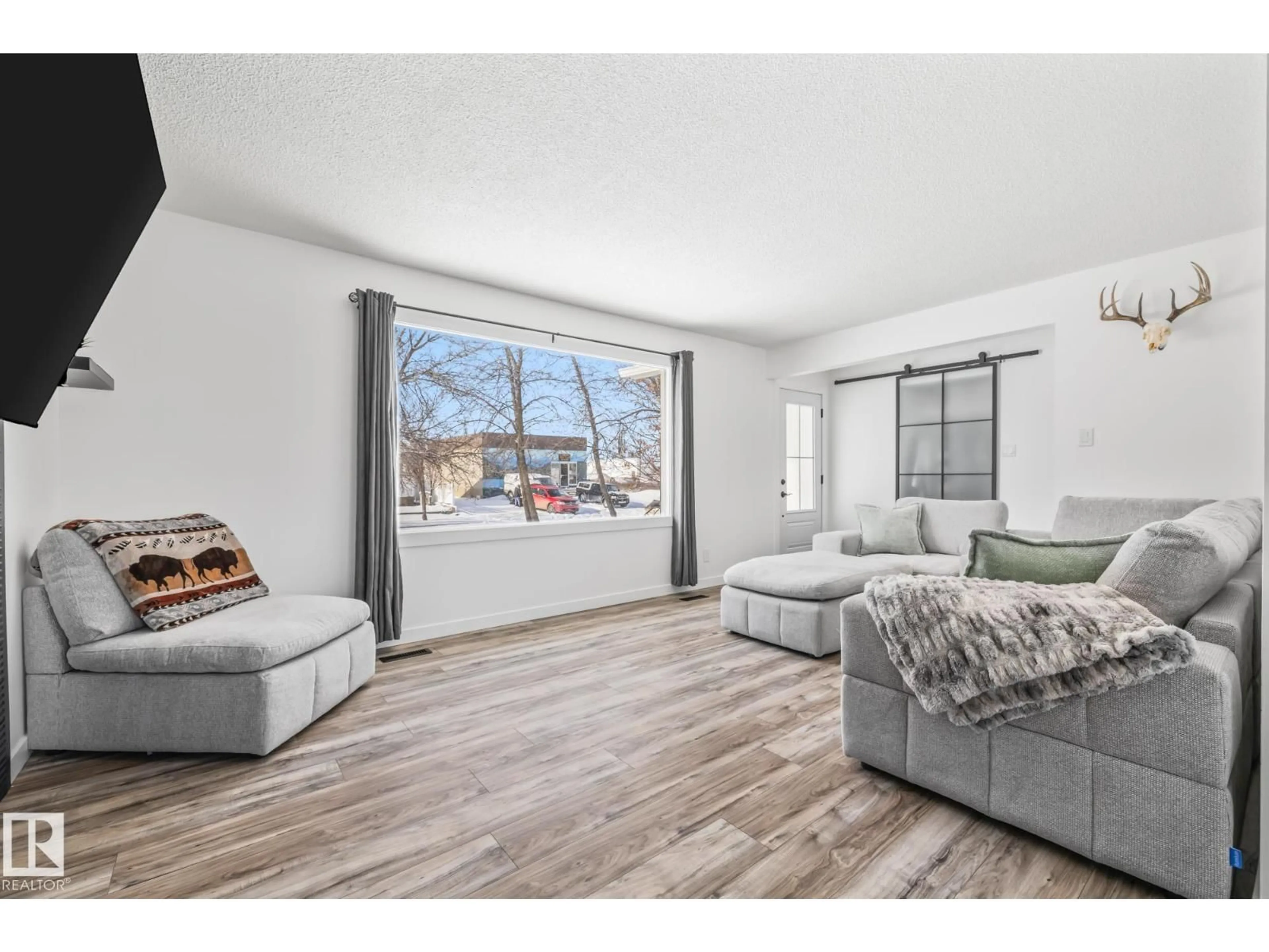 Living room with furniture, wood/laminate floor for 5016 48 AV, Lamont Alberta T0B2R0