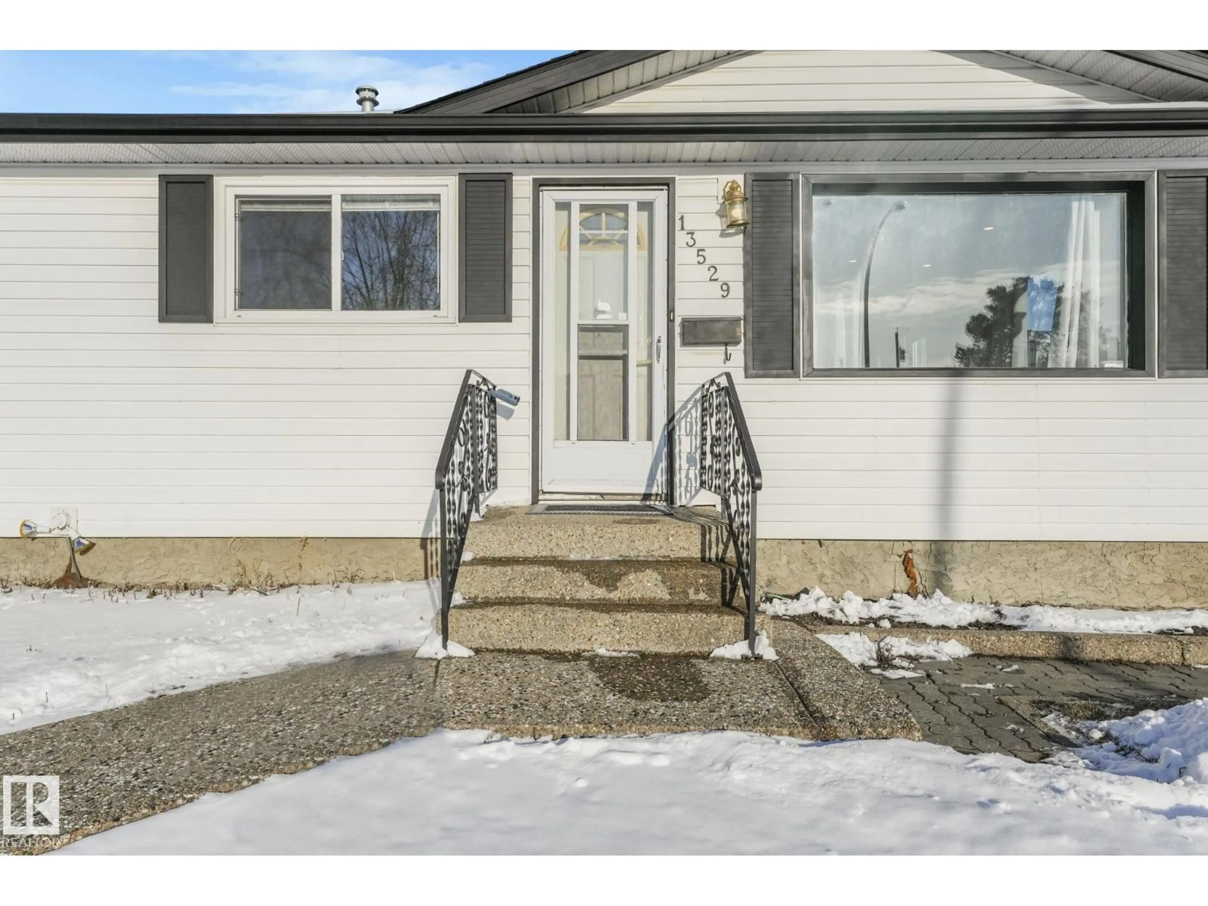 Home with vinyl exterior material, street for 13529 69 ST, Edmonton Alberta T5C0H7