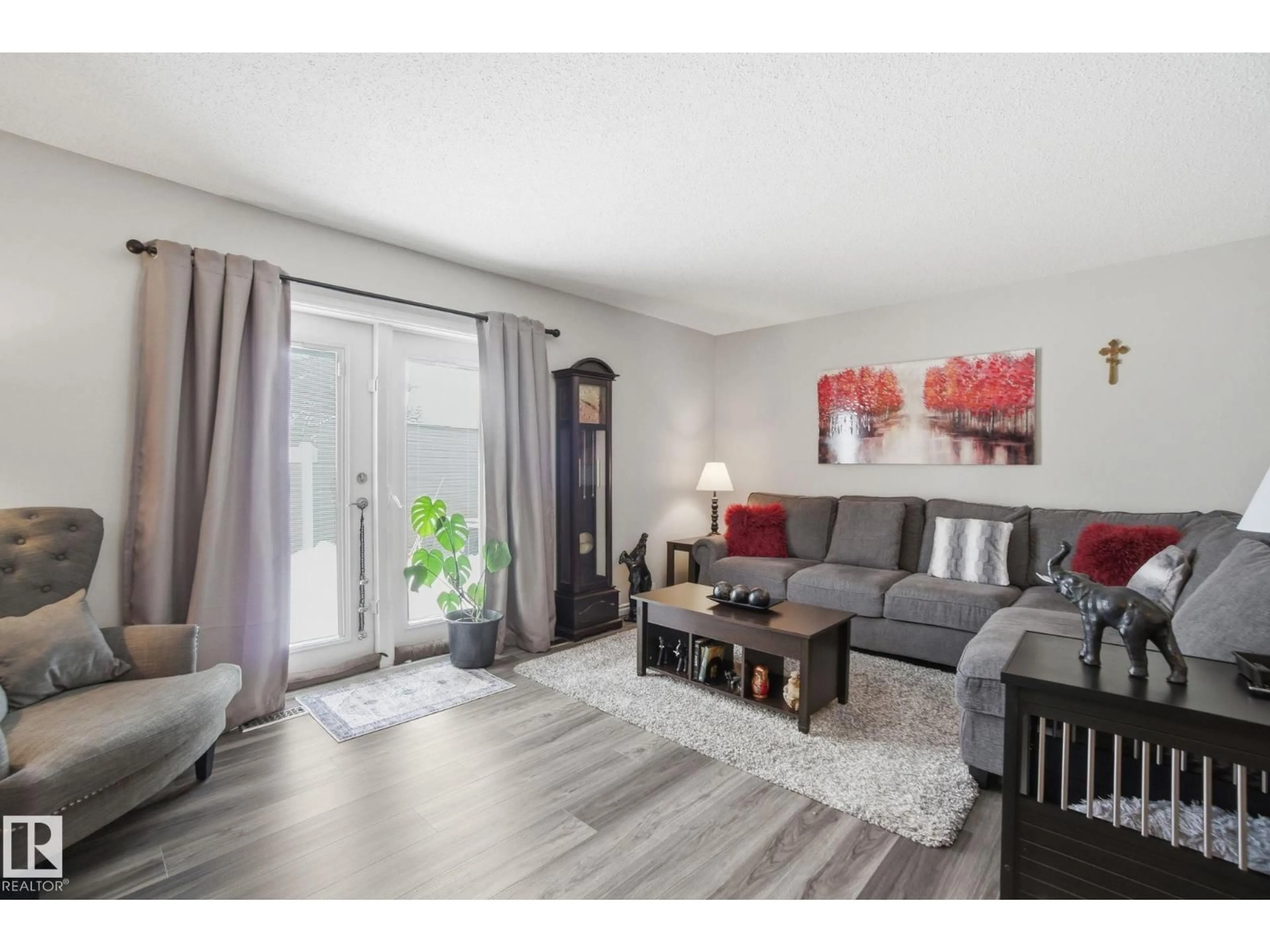 Living room with furniture, wood/laminate floor for 150 WOODBOROUGH WY, Edmonton Alberta T5Y1N2