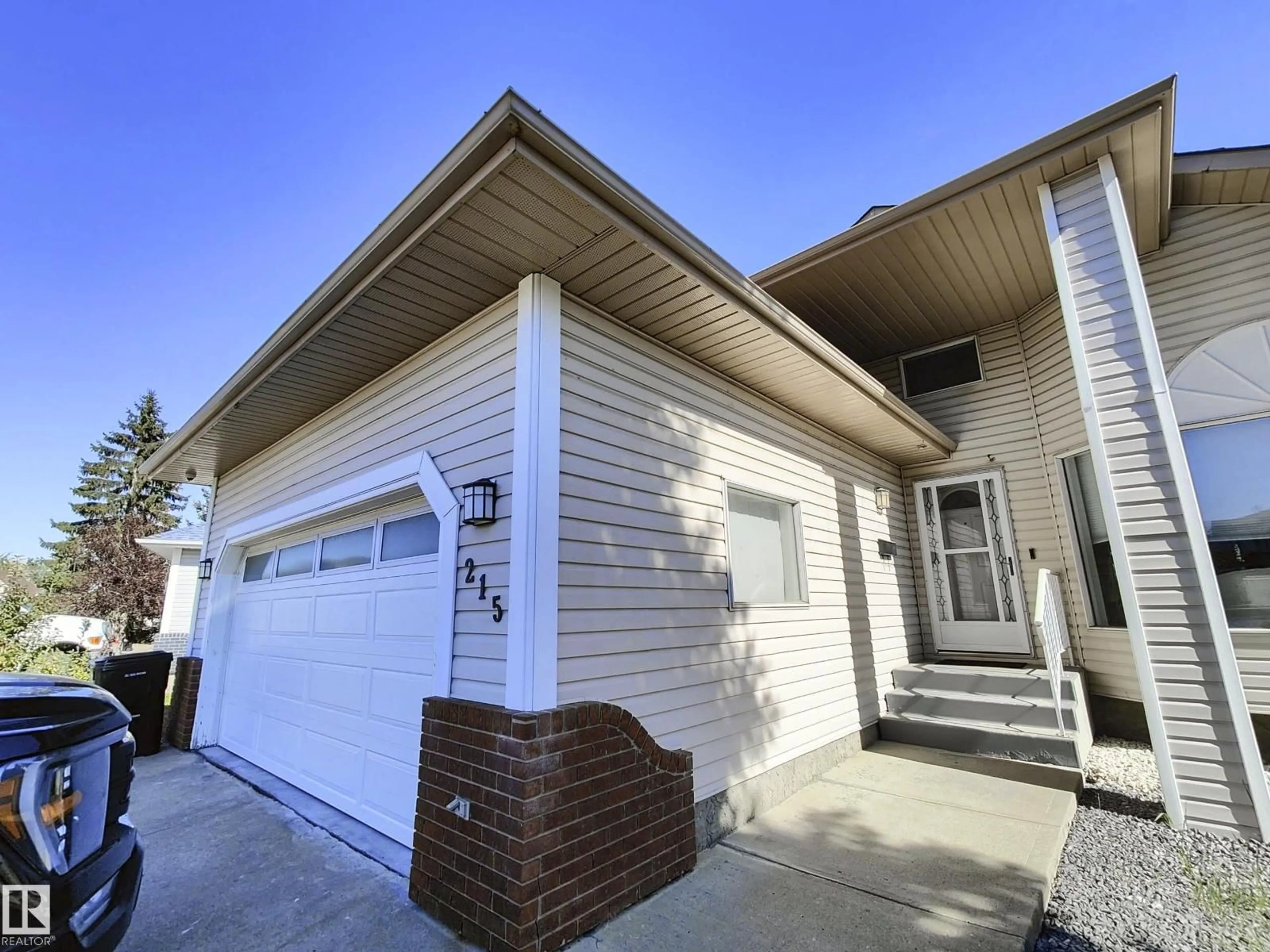 Home with vinyl exterior material, street for 215 PETER CL NW, Edmonton Alberta T5T5Y5