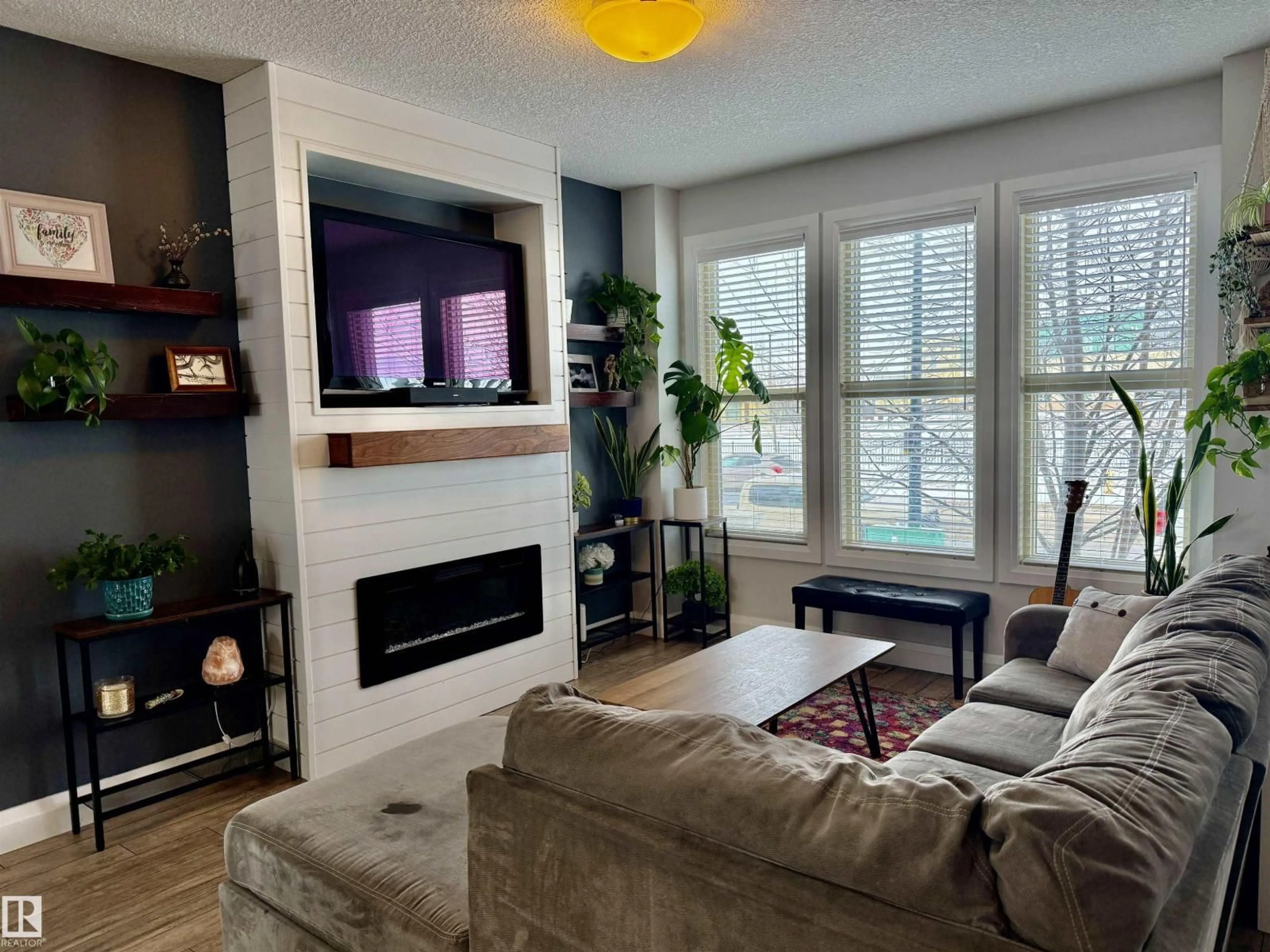 Living room with furniture, wood/laminate floor for 321 PIONEER RD, Spruce Grove Alberta T7X2T1