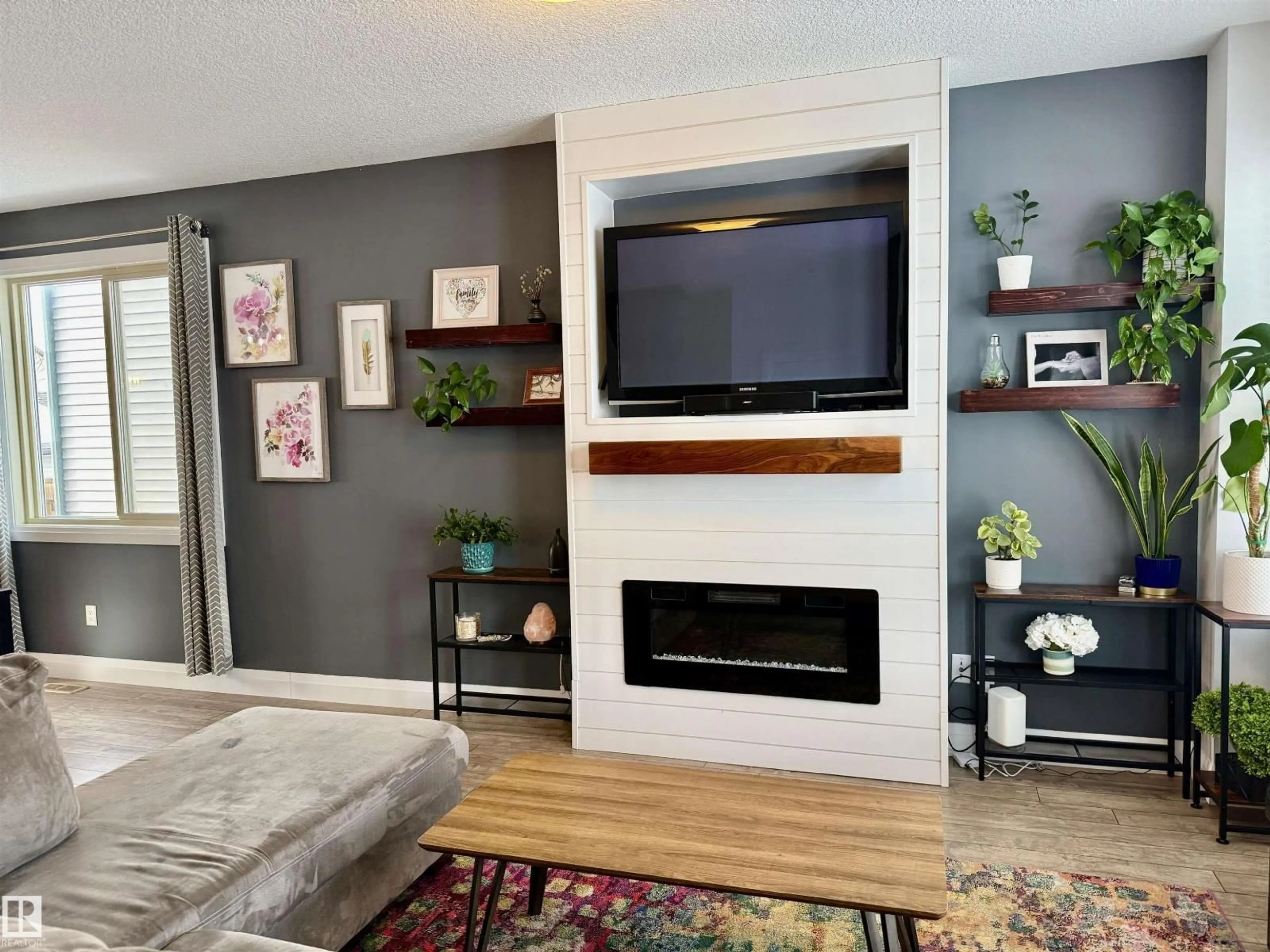 Living room with furniture, wood/laminate floor for 321 PIONEER RD, Spruce Grove Alberta T7X2T1