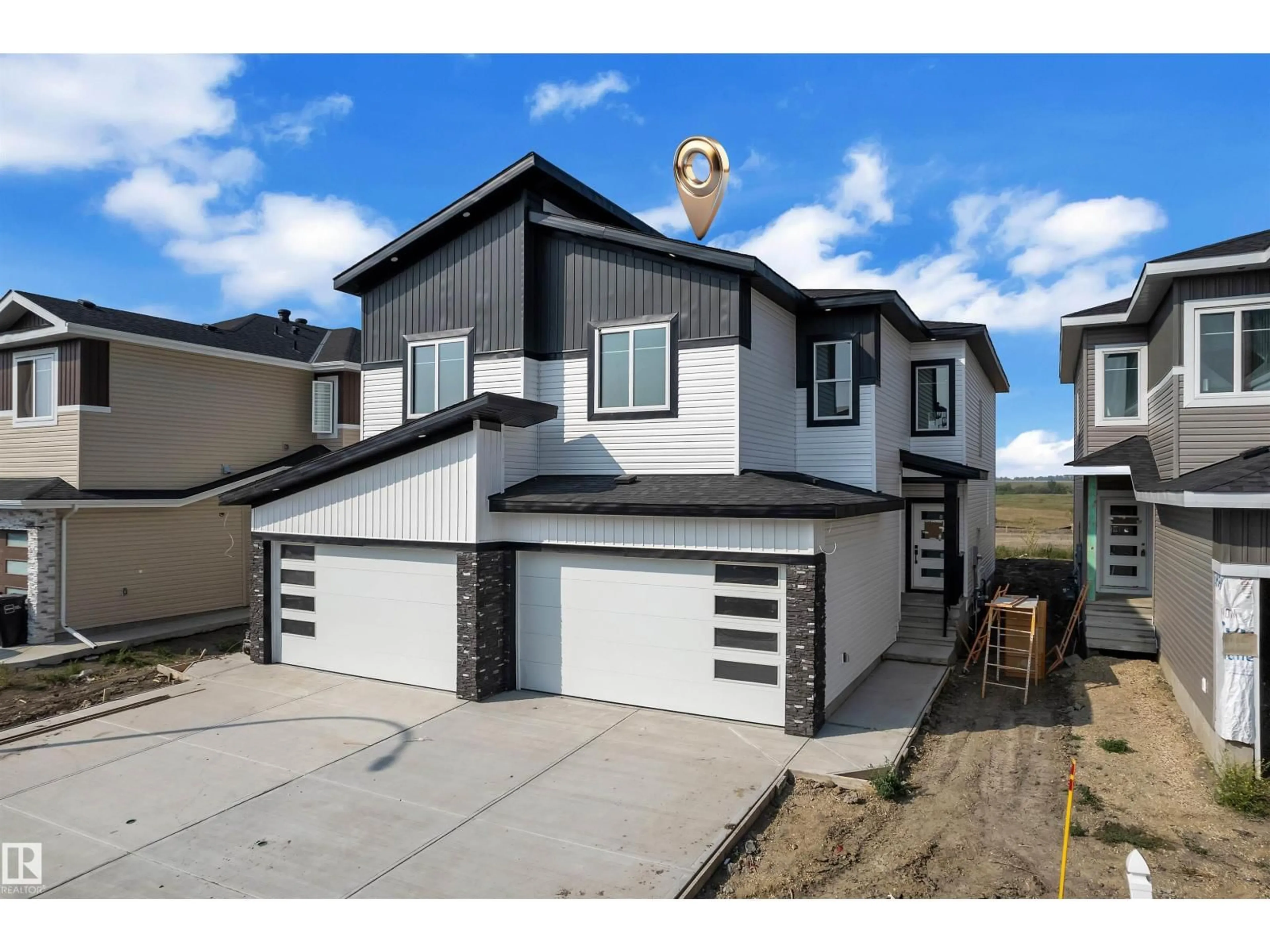 Home with vinyl exterior material, street for NW - 1908 155 AV, Edmonton Alberta T5Y4H8
